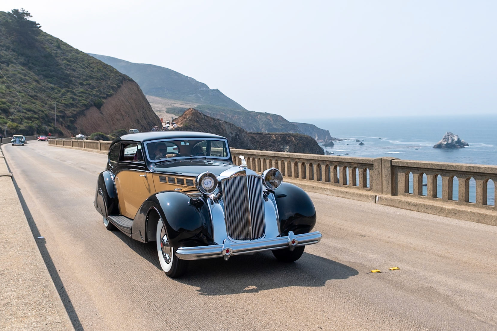 Known by Packard aficionados as the Sixteenth Series, the 1938 Super Eight quickly became the best-selling Packard of the era. Packard survived the Depression reasonably well due to the fact that it diversified its offerings; while many of its competitors were building only V12 engines, Packard realized that the cheaper-to-build 8-cylinder motor could be equally smooth and powerful, so it continued to offer both Eights and Twelves on different chassis. This unique custom-bodied Super Eight Coupe was ordered by a European shipping magnate. The bare chassis was delivered to the Mayfair Carriage Company in London to be fitted with this stylish and very British two-door body. After the war, the car was sadly neglected; it was abandoned and was being used as a chicken coop! Its rescuer, an American Naval officer, brought it back to the United States, and it has since been restored to its former glory by its current owner.