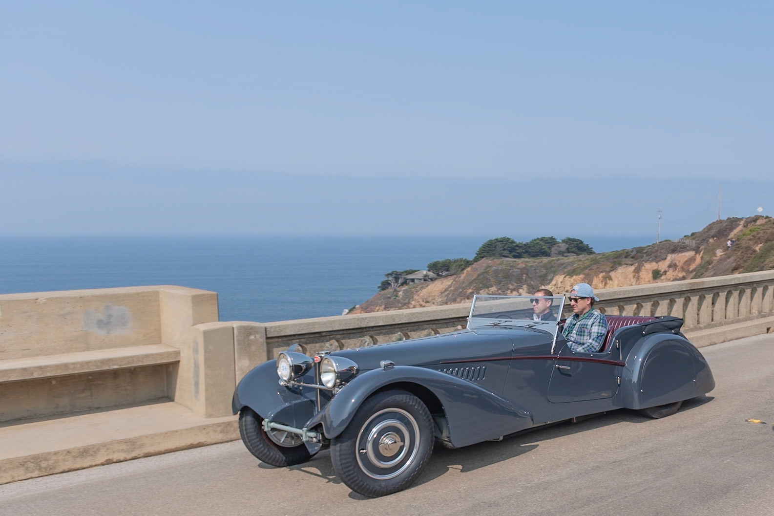 This Bugatti Type 57S (chassis 57541) was originally ordered from the marque’s London agent by American racing driver George Rand. The bare chassis was sent to Vanden Plas to build a sports tourer body similar in style to a Bugatti owned by Malcolm Campbell. The finished car was shipped to New York, where it was first driven in the A.R.C.A. races on September 25, 1937. Afterward, the car was shipped back to London to be sold, and it was shown on the Bugatti stand at the 1938 Olympia Motor Show. In 1947, Jack Robinson bought the car and exported it to Trinidad where, equipped with a Type 35B supercharger, it was raced by Robinson at the Trinidad Aerodrome. There it remained for more than thirty years before returning to England with British collector Peter Agg, who rebuilt it and regularly used it in vintage hill climbs and circuit races. Its current owner acquired the car in 2016 and has returned it to its original specifications, complete with its original Vanden Plas body panels and original engine.