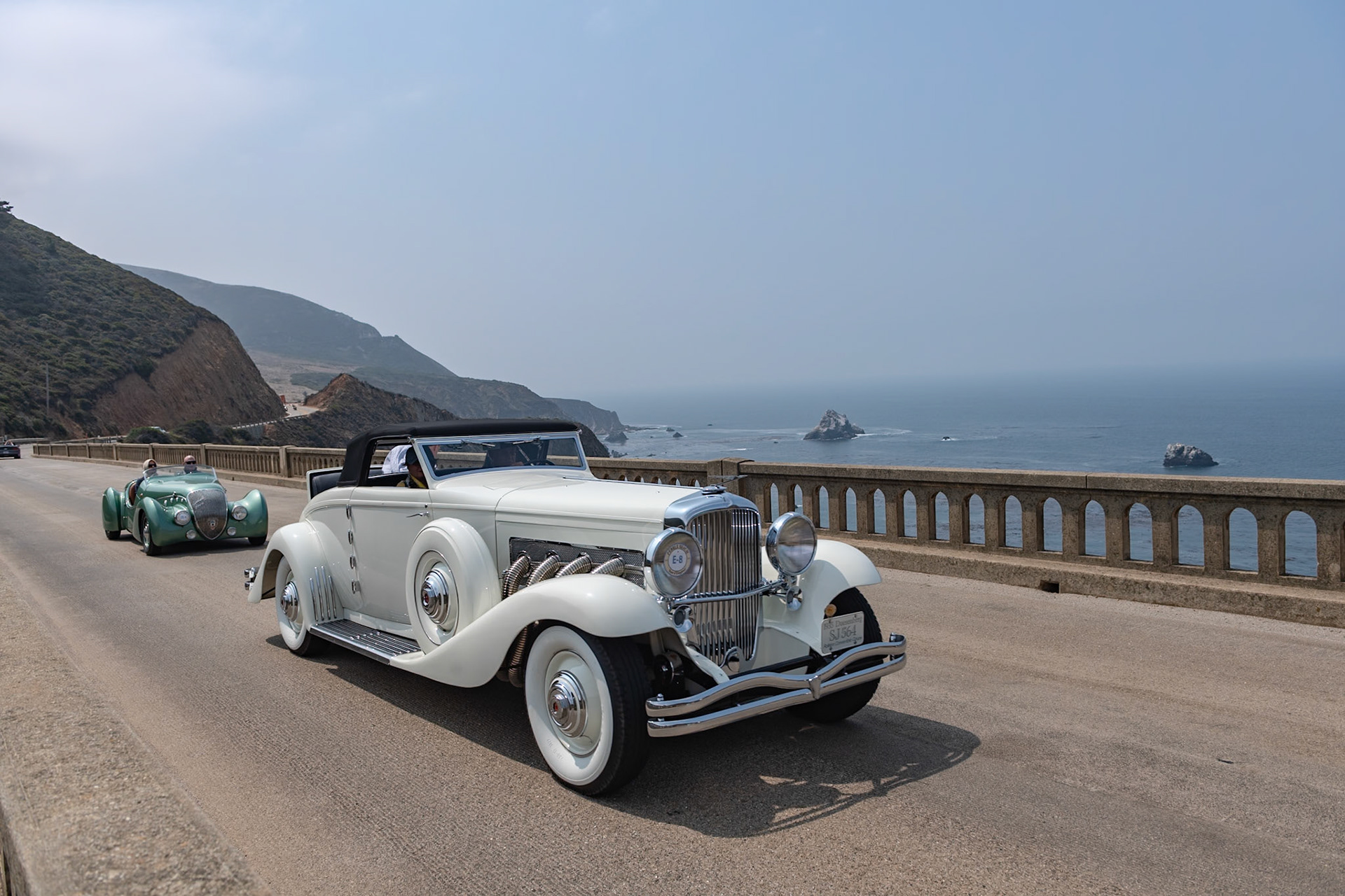 The rarest and perhaps the most desirable Duesenberg model is the SJN, which combines a supercharged SJ engine with the lower and wider bodywork from the JN, first seen in 1933. Only five Model JN convertibles were built by Rollston, and this car (J-564) is the only one with a factory-equipped supercharger. All of the Rollston convertibles were designed by Herb Newport, and the first one was bought by Hollywood legend Clark Gable. Aluminum alloy was used extensively in the engine as well as many other mechanical components, which kept the weight of this massive car down to just under 5,200 pounds and allowed even an un-supercharged Model JN to achieve a staggering 89 mph in second gear and over 120 in top. This car was owned for nearly 60 years by the same family before being acquired by its current owner in 2000. Since then it has been sympathetically refurbished, keeping almost all of its original features intact.