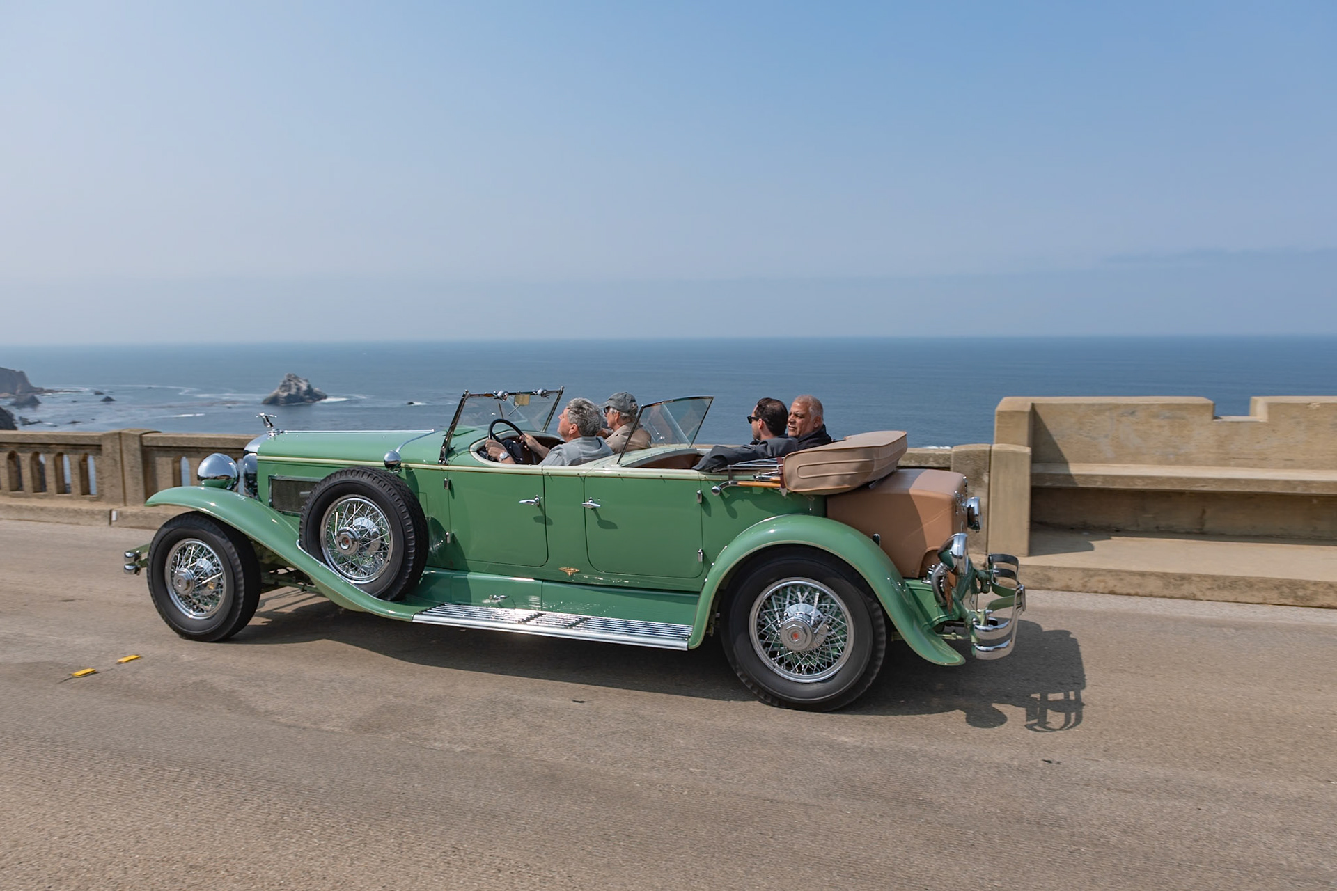 The Duesenberg Model J was available on either a long wheelbase of 153.5 inches for 7-passenger coachwork or a standard chassis of 142.5 inches. This Duesenberg J with Tourster coachwork by Derham is built on the longer chassis. The Tourster style was designed by Gordon Buehrig and, unlike other Dual Cowl Phaetons, it features a second windshield that slides up and down behind the front seat by means of a crank handle. The Tourster was Buehrig’s favorite design and he chose the Derham Body Company of Rosemont, Pennsylvania, to be the exclusive builder of this coachwork. This Duesenberg (J451) is one of eight original Tourster models. It was sold new to David G. Joyce of Chicago. Today it is one of very few remaining original examples of what many consider to be Derham’s most beautiful coachwork.