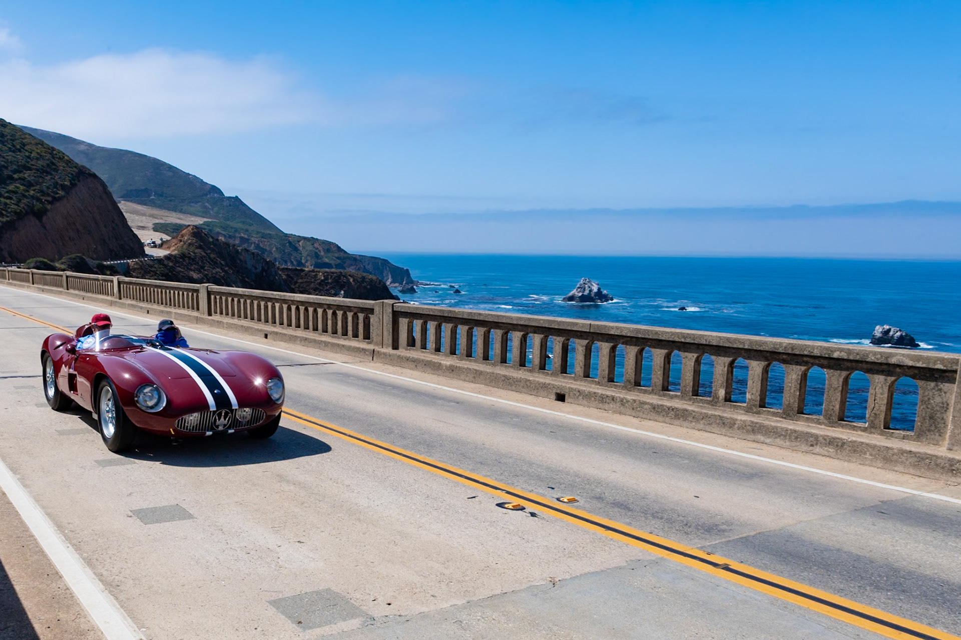 Maserati introduced its 6-cylinder, 3-liter 300S in order to compete with Ferrari’s 3-liter 750 Monza for the 1954 season. The lightweight chassis was developed from the previous Maserati A6GCS, and the body was built by Fantuzzi. Between 1955 and 1959, twenty six cars were built, and they were piloted by race drivers such as Luigi Musso,  José Froilán González, Harry Schell and Jean Behra. This car (chassis 3058) was ordered by Scuderia Parravano. It was first tested by Peter Collins at Modena and then, after arriving in the United States, was immediately successful at Palm Springs in the hands of Masten Gregory. A month later Gregory won on the Torrey Pines circuit against Phil Hill, who was in a Ferrari. When Parravano disappeared to Mexico in 1960 all his cars went with him, and this 300S didn’t return until 1977. It was then acquired by the Hayashi Collection. The current owner purchased it in 2000.
