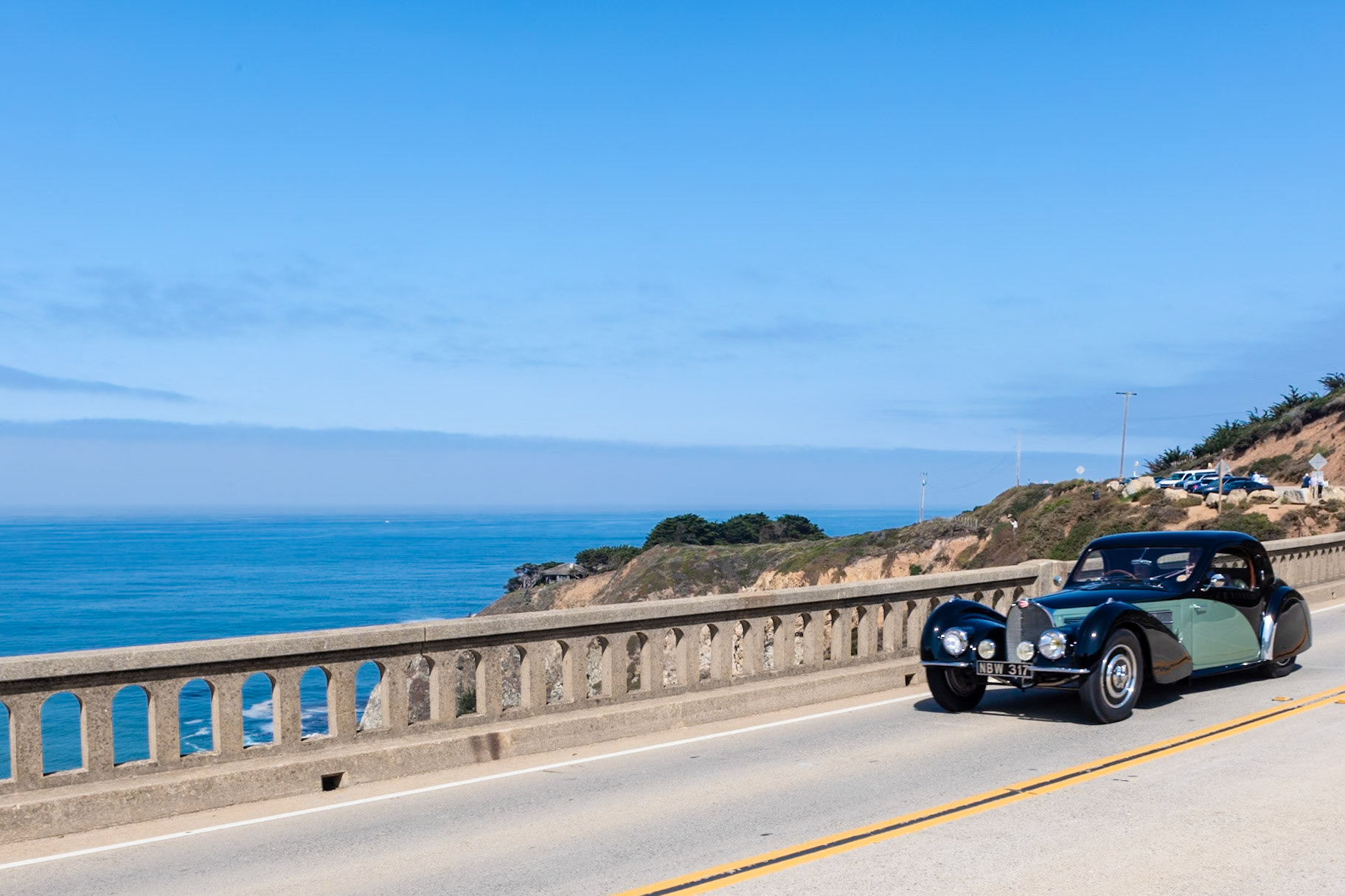 The Bugatti Type 57S was built in Molsheim between 1936 and 1938. The “S” stood for surbaissé, meaning lowered, but the car was in effect an entirely new sports car. The new model was an immediate success although just 43 Type 57S chassis were built by the factory. The high-compression engine was also offered with a Roots supercharger, and only two of these supercharged S chassis were sold by Bugatti although many chassis were later uprated. The Type 57S was available with factory-built Atalante coachwork, but the chassis was often bodied by other coachbuilders. This example (chassis 57501) has a coupé body by Gangloff with lines similar to the Atalante. The unique 3-seater was fitted for its first owner, Camille Jourde. The car later spent a short period at the Schlumpf Museum in Mulhouse, France, but then was brought to America. It was last shown at the 2007 Pebble Beach Concours d’Elegance where it was awarded the coveted French Cup.