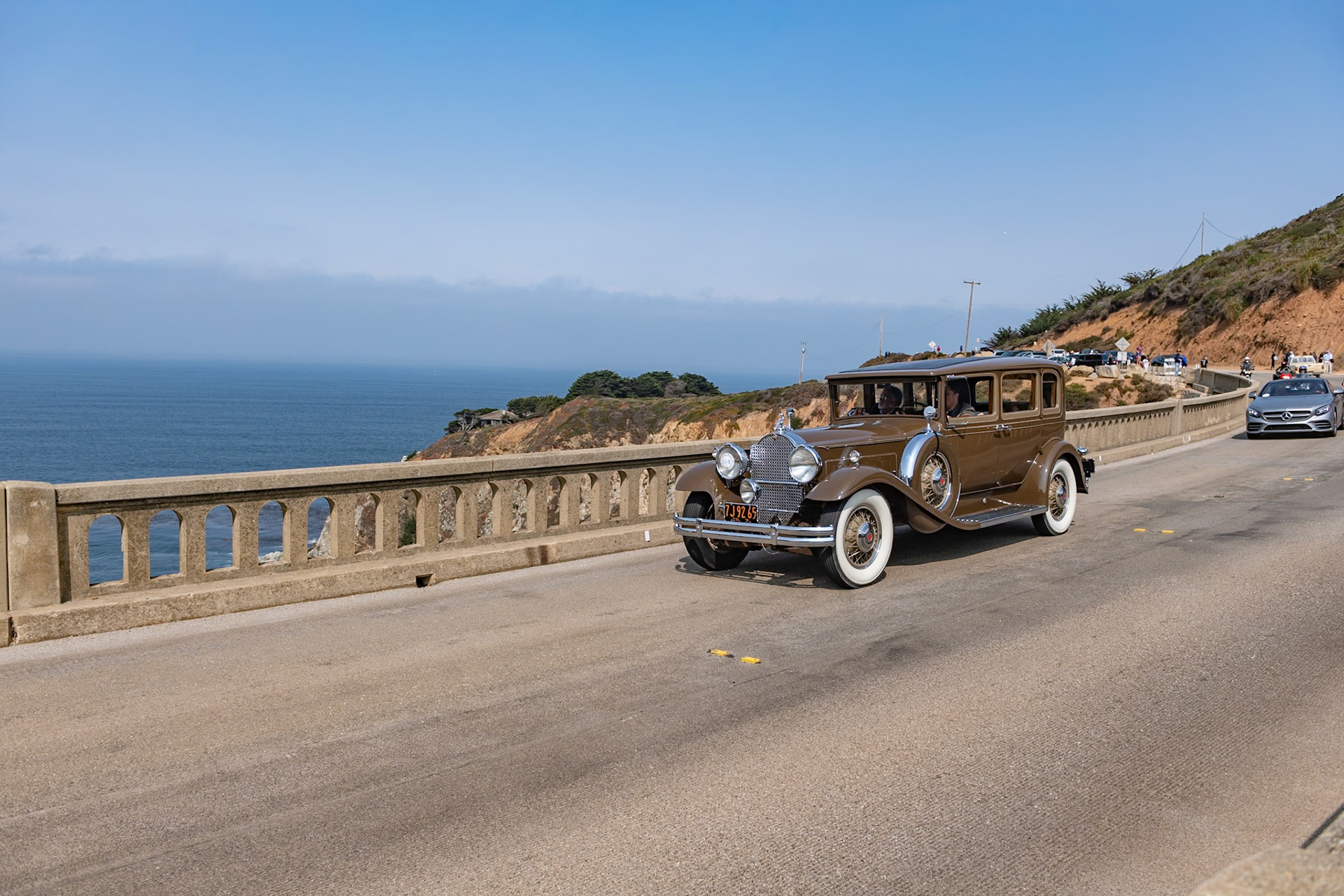 In 1931, most American car manufacturers were feeling the effects of the Great Depression, and Packard was no exception. Packard’s plan for survival was to concentrate solely on its top-of-the-range lineup, the 826 and 833 Standard Eight and the more expensive 840 and 845 Custom or DeLuxe Eight. This Packard 840 5 Passenger Sedan was loaded with accessories by Earle C. Anthony, Packard’s San Francisco dealer. These included chromed spare tire covers, a radiator stone guard, and a special Adonis hood ornament, all of which have remained with the car throughout its life. The original black fenders were repainted to match the rest of the chocolate brown body before the car was delivered. About ten years later, and with less than 40,000 miles on the clock, the car was put in storage. It was found by our esteemed Chief Judge, Chris Bock, who purchased the car from the son of the original owner in 1963. After a further two owners, and still in unrestored condition, it was bought by the current owner in 2009.