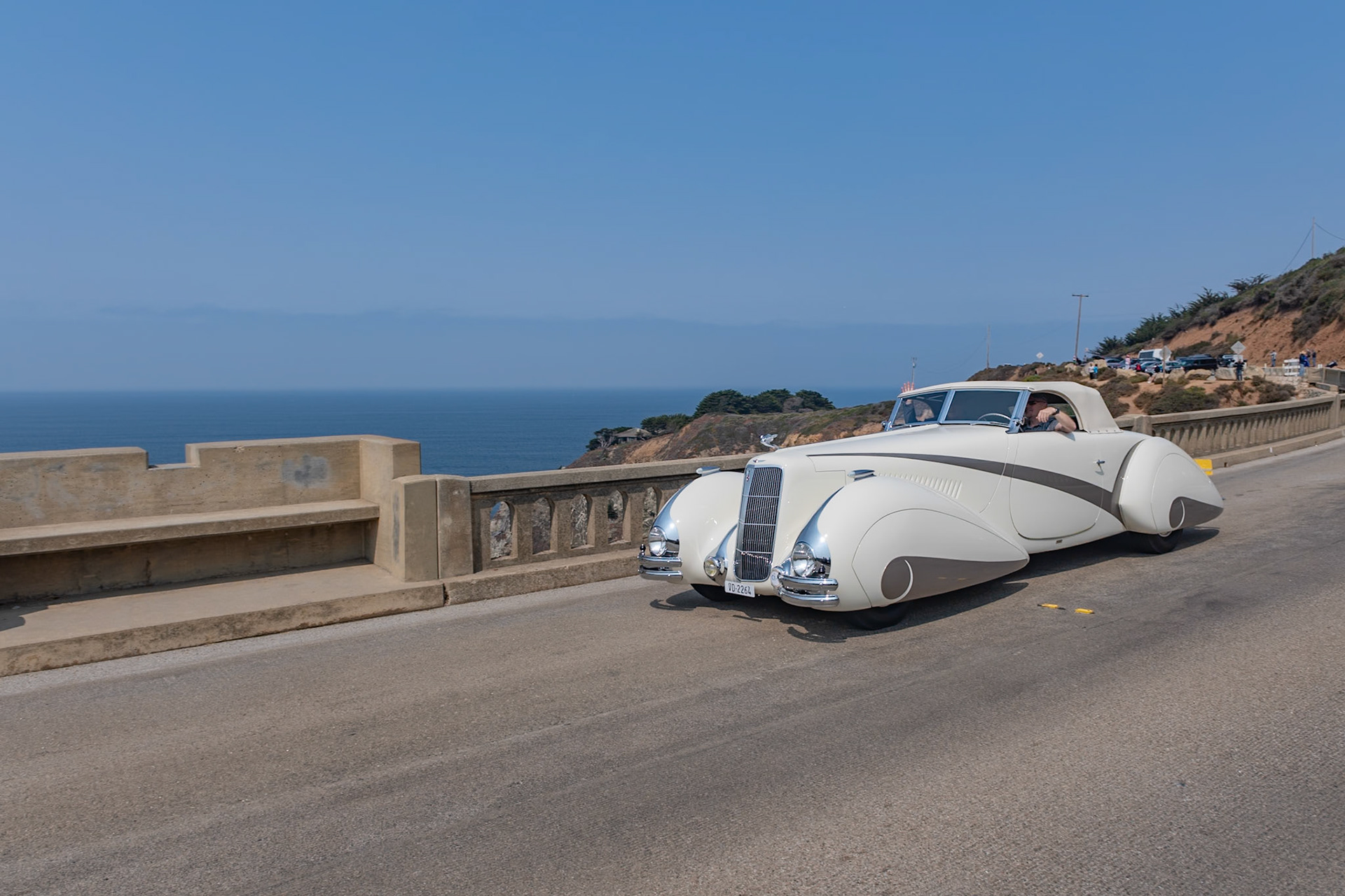 In 1937 Cadillac built fifty of their most expensive Series 90 V-16 chassis, and all but two were bodied in-house by Fleetwood. This chassis was delivered to Lausanne, Switzerland, to be bodied by Carrosserie Hartmann per an order by local resident Philippe Barraud, a wealthy playboy of the 1930s. Barraud wanted an outrageous, bespoke automobile to suit his stylish lifestyle. Stretching 22 feet in length, the car was designed in the sweeping cabriolet style of the Delahaye built by Figoni &amp; Falaschi for the 1936 Paris Auto Salon. The car soon suffered several accidents, possibly because its size was unsuitable for small European roads, and it was permanently parked in 1939. Then it was all but abandoned until the summer of 1968 when a second owner acquired it for just $925. Over the following 50 years it changed hands many times and gained several nonoriginal embellishments, but this unique and imposing Cadillac V-16 now has been meticulously restored to its original configuration and its original off-white paintwork with distinctive gray body stripe and fender skirts for its debut at the Pebble Beach Concours d’Elegance.