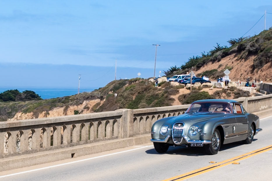 This unique coachbuilt Jaguar XK120 was shown at the 1955 Turin Motor Show before being sent to Max Hoffman in New York who had ordered it for an important client. Hoffman was the importer of many luxury European automobiles during the 1950s. He inspired the production of two significant vehicles, namely the Mercedes-Benz 300SL Roadster and the BMW 507. He also brought the first ever XK120 into the United States, and he personally worked with Battista Farina on this unique design to reinterpret the ground-breaking Jaguar. Only one of these cars was built by Pinin Farina although several other Jaguar XKs were bodied by other Italian carrozzerie. The early history of this car is not known, but it resided in Germany between 1979 and 2015, when its current owner acquired it and began to restore it.