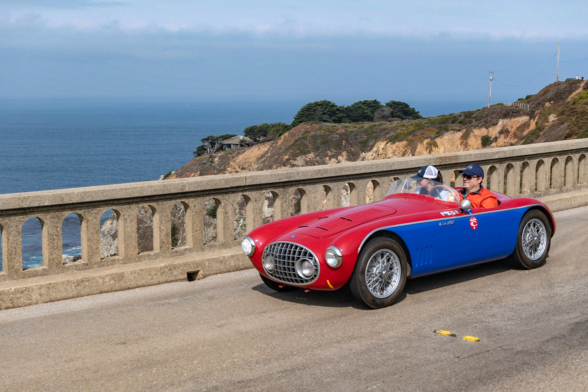 This OSCA MT4 (chassis 1114) was built by the factory in a more traditional spider-style. It had headlights within the oval grille so it could compete in the 1951 Mille Miglia, where it placed second in class driven by Franco Bordoni. For the rest of the season, with OSCA factory driver Giulio Cabianca at the wheel, it achieved a remarkable 14 class victories and 9 overall wins. In 1952 the body was prepared for the 24 Hours of Le Mans, with additional lighting cut into the fenders—but then the car didn’t race there. After buying a larger 1,350 cc OSCA engine, Cabianca added 8 wins to his 14 previous wins, for a total of 22 victories in 2 years. The car was then sold it to Al Garthwaite of Philadelphia and was entered in the 1953 Watkins Glen Grand Prix for Jim Kimberly, who finished second in class. Later, the car was sold to Otto Linton, who raced it at Sebring in 1954, placing third in class behind winner Stirling Moss. It’s last competitive appearance was in July 1956, when Linton finished second in class at the Brynfan Tyddyn circuit in Pennsylvania. This famous OSCA MT4 has been in the Mittler family since 2010.