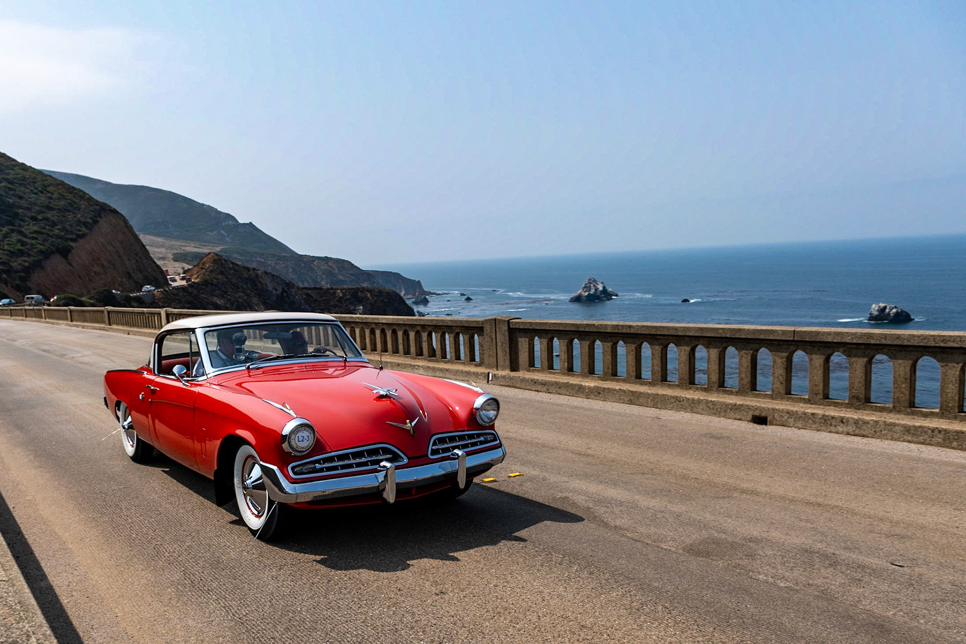The Studebaker Commander Starlight Coupe, designed by Raymond Loewy in 1954, was the first all-new Studebaker since 1947. Although it had a relatively old-fashioned V8 engine beneath its hood, the low-slung European design was far ahead of its time. This car was first purchased by William Babich of East Pittsburgh and remained with him for 60 years. He cared for this car so much that only his wife and a niece were allowed in the car—and they could not wear any clothing with buttons or zippers for fear of scratching the paint! From 1954 to 1959 Babich put just 6,683 miles on the car, using it only during the summer months. In 1960 he stopped using the car altogether, but would start it once a month and then drive it once a year to have it inspected. From 1963 to the present the car has only covered 80 miles. After William passed away, the Babich family made sure that the car went to someone who would treasure it as much as William had done—and in 2014, Wayne Carini became the car’s second owner.