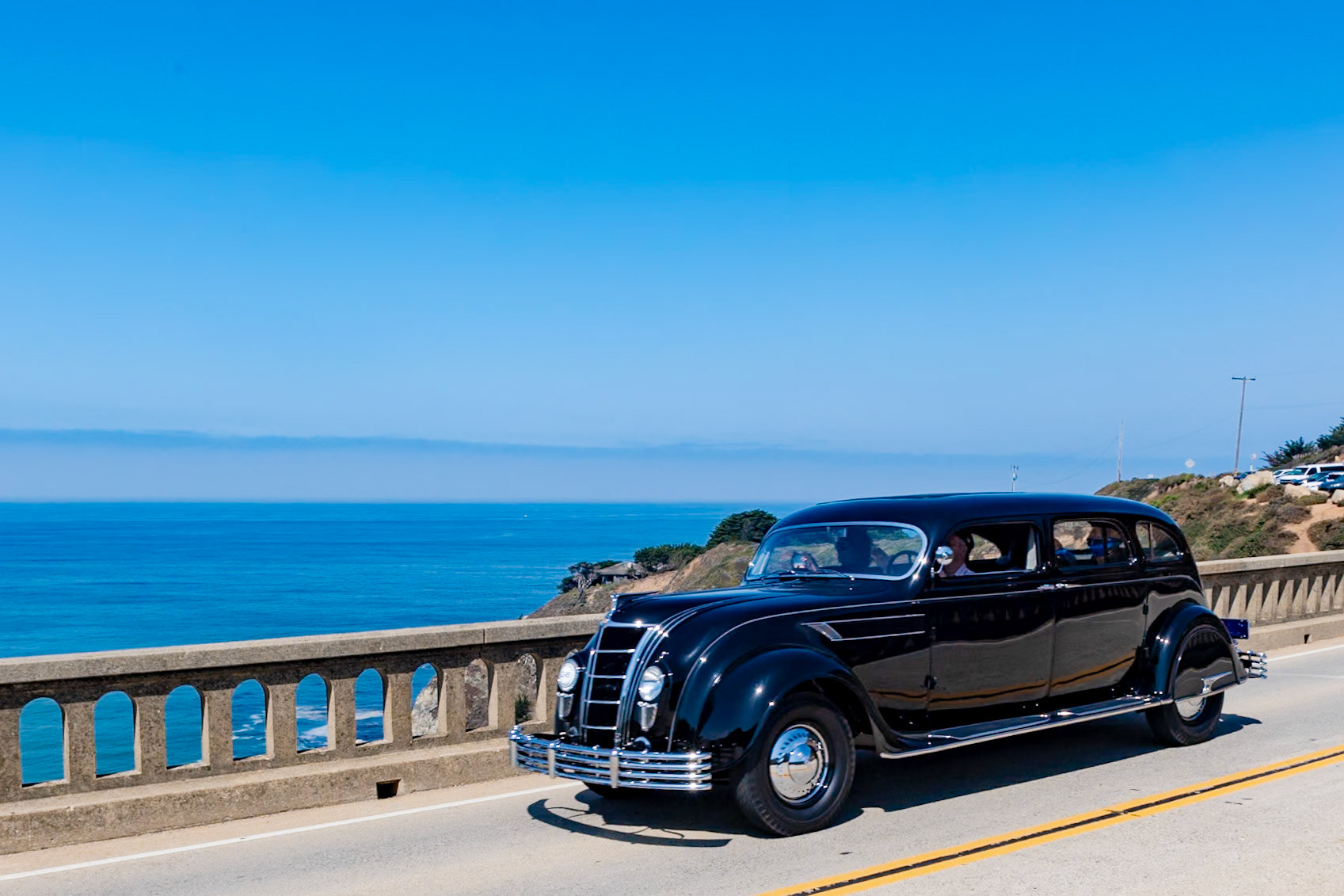 Produced from 1934 until 1937, the Chrysler Airflow used streamlining as the basis for a new kind of automobile. After testing at the Wright Brothers’ wind tunnel facilities in Dayton, Ohio, Chrysler threw away the traditional more upright style of car. Its engineers moved the headlights into the fenders, incorporated a sloping waterfall grille and on the CW model only introduced the first one-piece curved windshield in a production automobile. The 385-cubic-inch straight-8 engine was moved forward, significantly improving ride quality, and an industry-first automatic overdrive was fitted, allowing high-speed driving without taxing the engine. The car could seat eight people with three abreast in front and back and two in jump seats. Sadly, sales were disappointing; less than ten 1935 CW Imperial LeBaron Limousines were built, and this is the only surviving example. Ten years later nearly all of the Airflow’s radical features found their way onto many of the world’s automobiles.