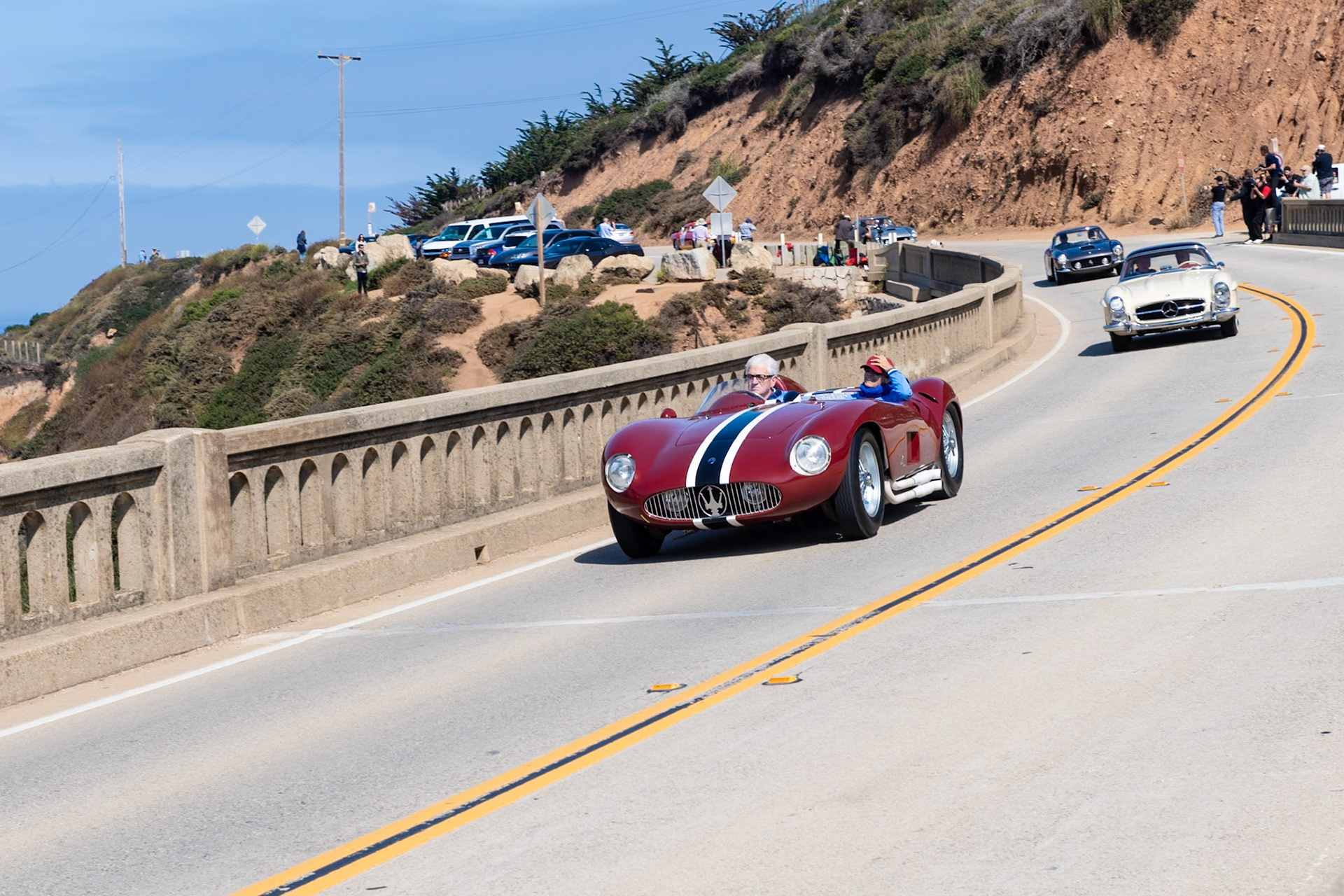 Maserati introduced its 6-cylinder, 3-liter 300S in order to compete with Ferrari’s 3-liter 750 Monza for the 1954 season. The lightweight chassis was developed from the previous Maserati A6GCS, and the body was built by Fantuzzi. Between 1955 and 1959, twenty six cars were built, and they were piloted by race drivers such as Luigi Musso,  José Froilán González, Harry Schell and Jean Behra. This car (chassis 3058) was ordered by Scuderia Parravano. It was first tested by Peter Collins at Modena and then, after arriving in the United States, was immediately successful at Palm Springs in the hands of Masten Gregory. A month later Gregory won on the Torrey Pines circuit against Phil Hill, who was in a Ferrari. When Parravano disappeared to Mexico in 1960 all his cars went with him, and this 300S didn’t return until 1977. It was then acquired by the Hayashi Collection. The current owner purchased it in 2000.