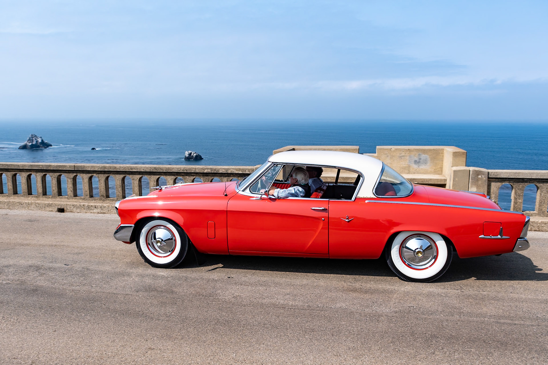 The Studebaker Commander Starlight Coupe, designed by Raymond Loewy in 1954, was the first all-new Studebaker since 1947. Although it had a relatively old-fashioned V8 engine beneath its hood, the low-slung European design was far ahead of its time. This car was first purchased by William Babich of East Pittsburgh and remained with him for 60 years. He cared for this car so much that only his wife and a niece were allowed in the car—and they could not wear any clothing with buttons or zippers for fear of scratching the paint! From 1954 to 1959 Babich put just 6,683 miles on the car, using it only during the summer months. In 1960 he stopped using the car altogether, but would start it once a month and then drive it once a year to have it inspected. From 1963 to the present the car has only covered 80 miles. After William passed away, the Babich family made sure that the car went to someone who would treasure it as much as William had done—and in 2014, Wayne Carini became the car’s second owner.