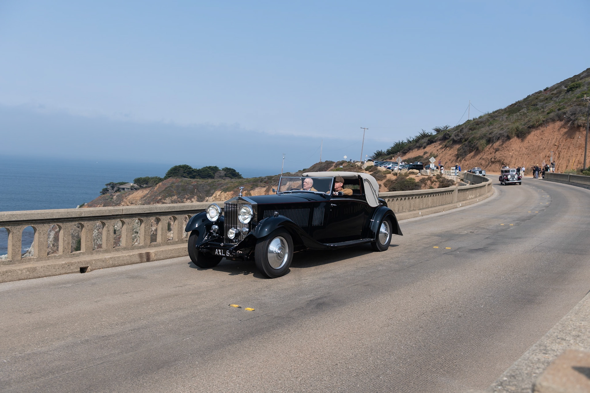 The Rolls-Royce Phantom II was the third and last of the Rolls-Royce 40/50 HP models, with an improved engine in an all-new and lower chassis. The engine was bolted directly to the 4-speed manual transmission, to which synchromesh was added after 1932. The Phantom II was designed with a 150-inch chassis, but a revised prototype was built on a 6-inch-shorter “Continental” chassis in 1930 and shown at the Biarritz Grand Concours d’Elegance, where it was awarded the Grand Prix d’Honneur. This car was the first of the PII Continental models, which proved popular with more adventurous drivers. This Phantom II (chassis 104PY) features a desirable 3-position Drophead Coupé body by H. J. Mulliner &amp; Co. Ordered by its first owner for long trips to Europe, it came to the United States in 1958. Its current owner acquired the car in 2016 and commissioned a full restoration.