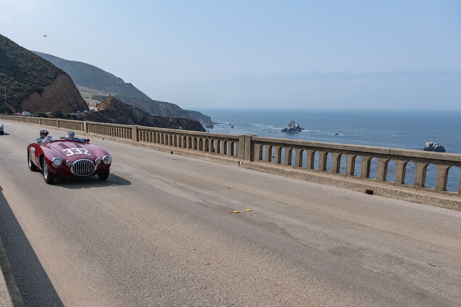 In the spring of 1953, OSCA built two Formula 2 single-seat race cars powered by Ernesto Maserati’s new 2-liter, 6-cylinder engine. Alongside the single seaters, OSCA built five sports car chassis to the same specification, of which this is the second 2000 S chassis built, and it was bodied by Frua. This car’s first owner, Luigi Piotti, raced it extensively in Italy, including the Giro di Sicilia and the Mille Miglia. At the end of the year, the car was sold to an owner in the United States, where it was raced extensively before being sold to Jim Hall of Chaparral fame in 1958. During the late 1970s, the car was acquired by John Robson of South Carolina. Because the original engine had blown up some years prior, it was replaced by an experimental 2.5-liter Grand Prix engine, which is still with the car. Several owners later, this unique OSCA was acquired by its current German custodian, who set about restoring the car, refitting many of its original panels and painting it a period-correct dark red color finished with its original Giro di Sicilia racing numbers.