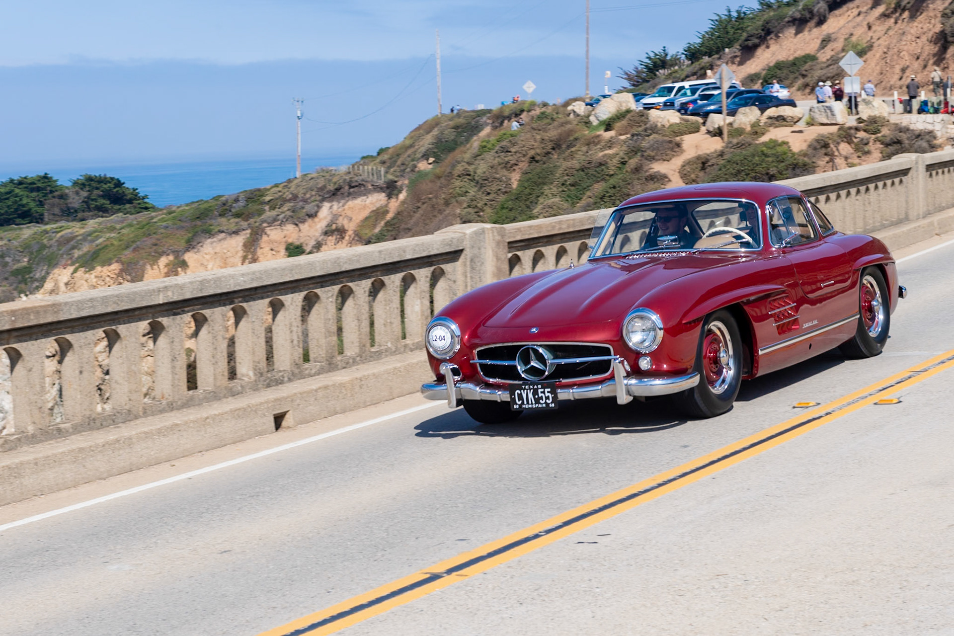 This Mercedes-Benz 300 SL Gullwing (chassis 4500120) was completed in December 1954, four months into production of the 300 SL. It was owned by two motor racing greats: George Tilp, who managed the Mercedes factory racing cars from 1955 to 1958, and Jim Hall, the Chaparral Can-Am winning constructor who pioneered aerodynamics in motorsport. The Gullwing was the first of three raced by Tilp, and these cars won the 1955, 1956, and 1957 SCCA class D championships. Jim Hall bought the car in 1958 and drove it from New Jersey to Carroll Shelby’s workshop in Texas, where he had the car painted in the candy apple red lacquer that it still wears today. He also re-did the interior in tan leather and installed an air conditioning system to tackle the Texas climate. In 1965, Hall placed his cherished Gullwing in storage where it remained until 2016.