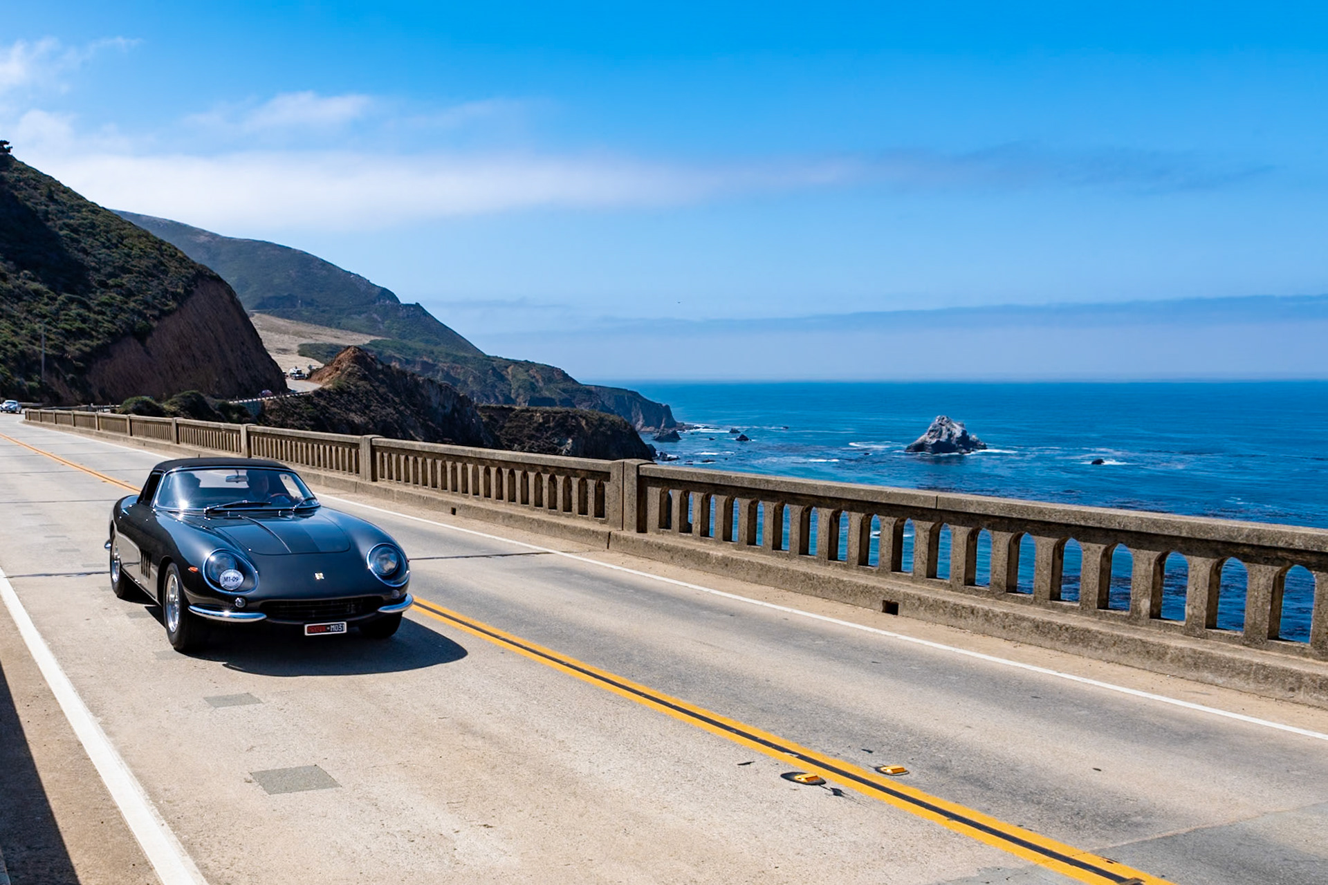 Following the introduction of the Ferrari 275 GTB/4, Ferrari’s New York distributor and founder of the North America Racing Team Luigi Chinetti convinced Enzo Ferrari to build a convertible for the American market. The new 275 GTB/4S (or GTS/4) NART with Scaglietti Spyder body soon appeared with Steve McQueen and Faye Dunaway in the film The Thomas Crown Affair and a small number were quite quickly sold. A few more found owners after a NART Spyder was raced at the 12 Hours of Sebring driven by Marianne “Pinky” Rollo and Denise McCluggage in 1967. Despite being front-page news just ten examples were built, and this car (chassis 11057) is the last of the ten. Known as the “European NART Spyder,” it was first delivered to a Spanish Colonel of the Foreign Legion, then was sold to Jose Segimon in Madrid. It was sold again in 1982, and it has since been owned and enjoyed by several notable Ferrari collectors in Europe and America.