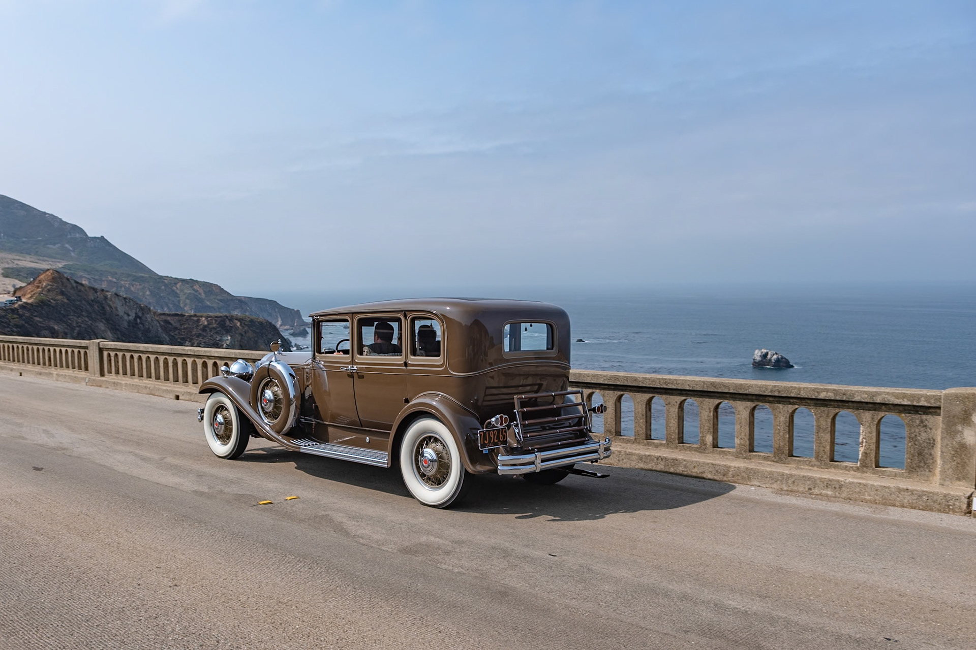 In 1931, most American car manufacturers were feeling the effects of the Great Depression, and Packard was no exception. Packard’s plan for survival was to concentrate solely on its top-of-the-range lineup, the 826 and 833 Standard Eight and the more expensive 840 and 845 Custom or DeLuxe Eight. This Packard 840 5 Passenger Sedan was loaded with accessories by Earle C. Anthony, Packard’s San Francisco dealer. These included chromed spare tire covers, a radiator stone guard, and a special Adonis hood ornament, all of which have remained with the car throughout its life. The original black fenders were repainted to match the rest of the chocolate brown body before the car was delivered. About ten years later, and with less than 40,000 miles on the clock, the car was put in storage. It was found by our esteemed Chief Judge, Chris Bock, who purchased the car from the son of the original owner in 1963. After a further two owners, and still in unrestored condition, it was bought by the current owner in 2009.