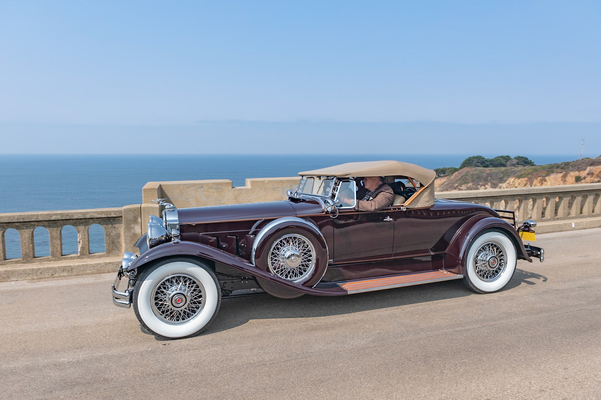 The Seventh Series Packards were introduced toward the end of 1929 just as the Stock Market began to tumble and customers for expensive motorcars were hard to find. Packard survived in part due to the marque’s reputation for reliability as well as its beauty, luxury and comfort. The big Packards were available on two chassis, the 140-inch Model 740 and the 5-inch-longer Model 745. Finished with either a factory body or a coachbuilt design they came with a selection of radiator mascots, including the Deluxe Goddess and the Adonis. Fewer than 1,800 Packard 745s were sold of which around 50 were roadsters. Beneath the long hood of this desireable Deluxe Eight Roadster lies a 385-cubic-inch, straight-8 engine. The factory body is fitted with a folding rear rumble seat windshield, and the car has chrome wire wheels and dual Pilot Ray fog lamps.