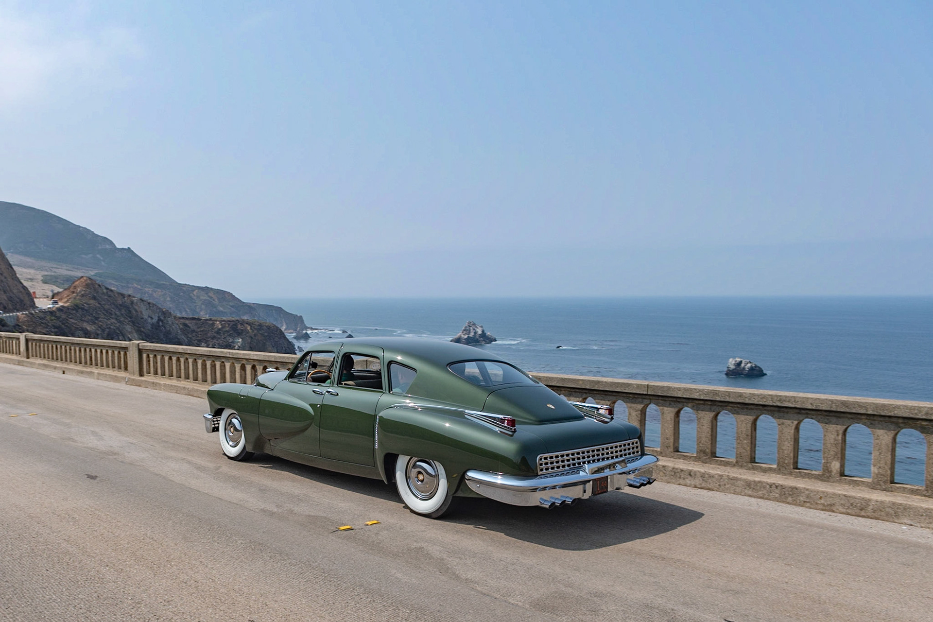 his car (chassis 1044) was the 44th of the 51 Tucker production cars built. After the Tucker factory closed at the end of October 1948, it was one of eight cars assembled by its designer, Alex Tremulis, and a handful of Tucker workers on their own time. Howard and Rosalind Kroplick purchased the automobile in January 2017, and since then, the Tucker has been driven fewer than 500 miles. The car is one of eight Tuckers originally finished in Andante Green with a green wool broadcloth interior.