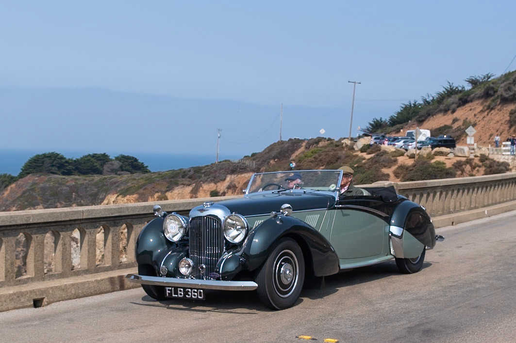 Alan P. Good, the new owner of Lagonda in 1935, recruited W. O. Bentley as his chief engineer to work on a range of engines and chassis. W. O. and his team designed an entirely new model, the Lagonda V12, which was built between 1937 and 1940. It is considered one of the finest V12-engined cars of the prewar era. The Lagonda V12 chassis featured independent torsion-bar front suspension and modern hydraulic drum brakes, and it wore bodywork ranging from open tourers to more formal limousines. Seventeen of the sportier Rapides were built on a shorter 124 inch wheelbase and had sleek drophead coupé coachwork penned by Frank Feeley and built in-house. This Lagonda Rapide is fitted with one of eight Le Mans specification engines, which featured four instead of two carburettors. In recent years it has had a ground-up restoration, and it has been shown at several events and driven on many rallies and tours.