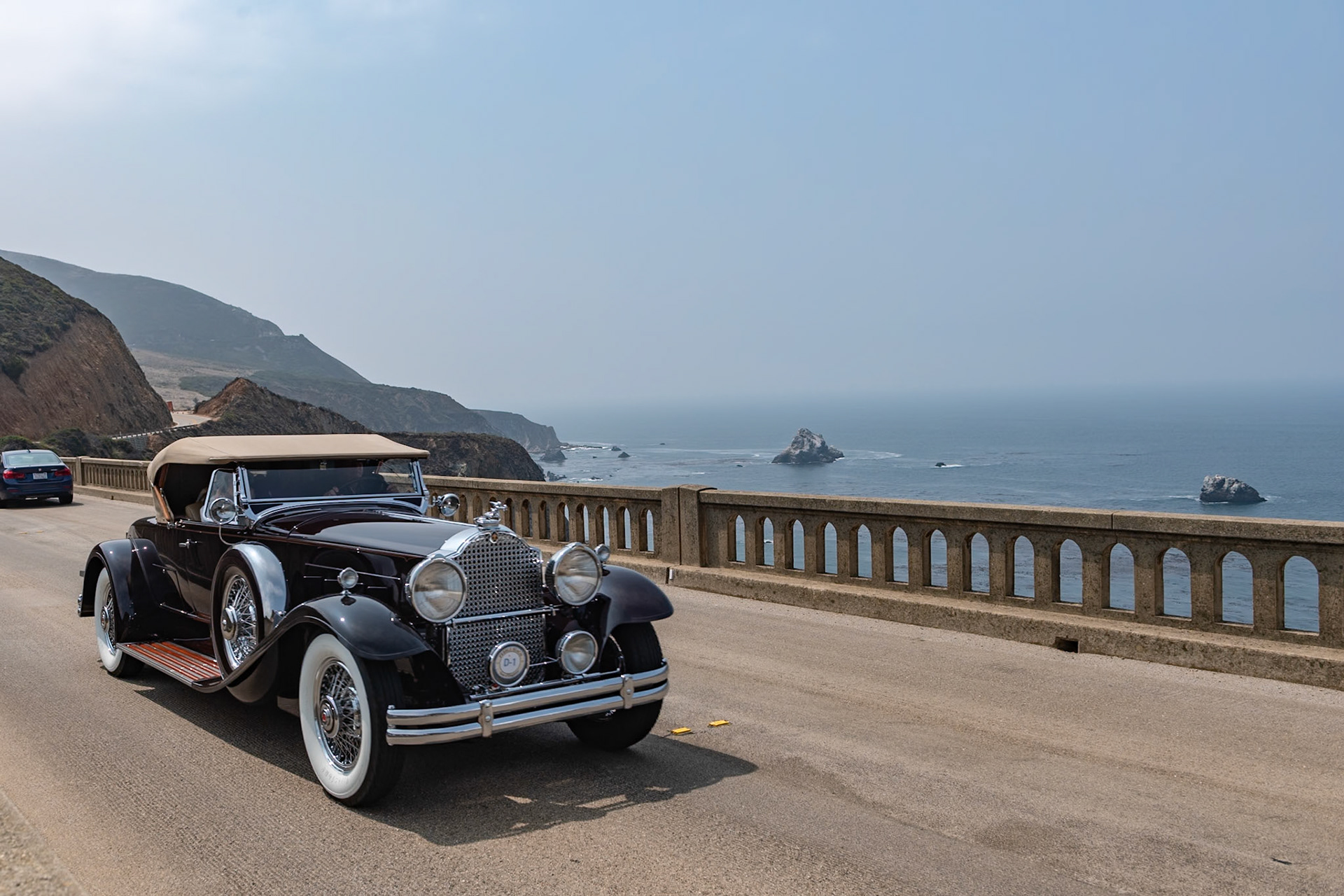 The Seventh Series Packards were introduced toward the end of 1929 just as the Stock Market began to tumble and customers for expensive motorcars were hard to find. Packard survived in part due to the marque’s reputation for reliability as well as its beauty, luxury and comfort. The big Packards were available on two chassis, the 140-inch Model 740 and the 5-inch-longer Model 745. Finished with either a factory body or a coachbuilt design they came with a selection of radiator mascots, including the Deluxe Goddess and the Adonis. Fewer than 1,800 Packard 745s were sold of which around 50 were roadsters. Beneath the long hood of this desireable Deluxe Eight Roadster lies a 385-cubic-inch, straight-8 engine. The factory body is fitted with a folding rear rumble seat windshield, and the car has chrome wire wheels and dual Pilot Ray fog lamps.