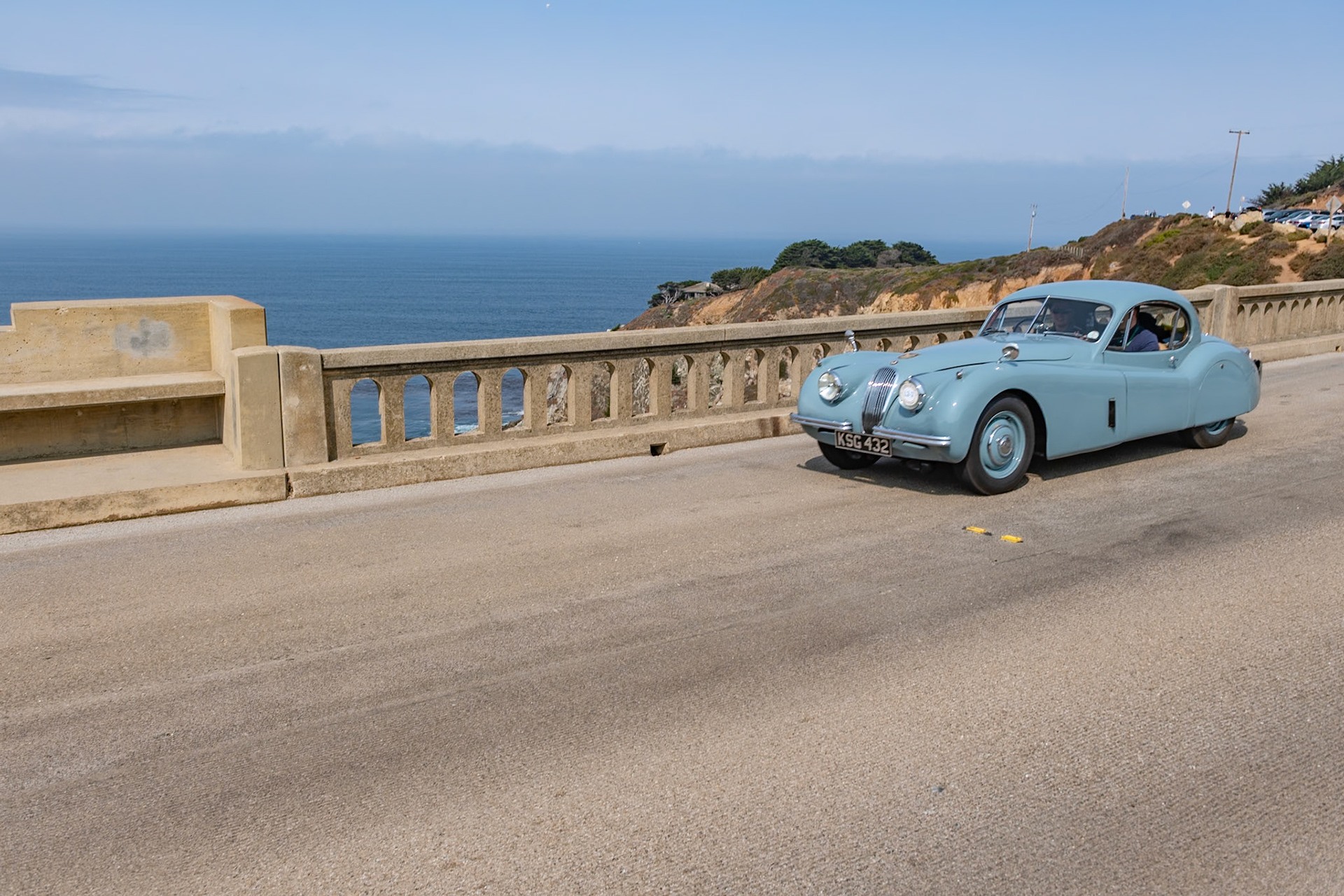 Launched at the London Motor Show in 1948, the Jaguar XK120 was an immediate best seller for both road use and also for racing. In 1951 the original open models were joined by an even more beautiful fixed head coupé. This very original example was first registered in Scotland in July 1953 and it remained north of the border for many years. The car was owned in the 1950s by a friend of David Murray, the owner of the Scottish racing team Ecurie Ecosse. Despite the car being well used over the years at many hill climbs, race meetings and sprints across Scotland, the car has survived those exertions with its original paint and interior still intact and still proudly wears its 60-year-old Ecurie Ecosse racing team stickers. This car has covered some 81,000 miles but has been treasured over the years by all of its owners who have shown a true dedication to maintaining its patina and provenance.