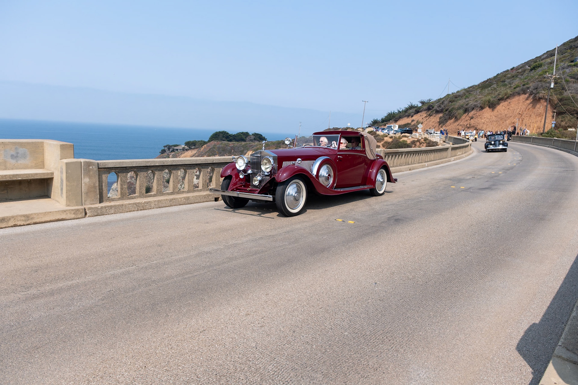 The much-improved Rolls-Royce Phantom II was introduced in September 1929, replacing the outdated New Phantom. Between 1929 and 1935, 1,672 Phantom IIs were built, including 280 on the stronger and shorter 144-inch Continental chassis, built to carry four people in comfort at high speeds. To balance the heavy chassis, lightweight coachwork was often fitted on it; the majority of Phantom IIs had 4-door closed coachwork, but a small number were fitted with more stylish designs, such as this Drophead Sedanca Coupé built by H. J. Mulliner in London. Described by Mulliner as a sportsman’s coupé, this is one of five similar PII Continentals built to be as lightweight as possible; they even included a special Exonite cellulose–covered aluminum steering wheel designed for aircraft. This Phantom II (chassis 55RY) was originally purchased by John “Jack” Upson, the owner of the famous Monseigneur Restaurant in Piccadilly and the chairman of the Dolcis shoe empire. It was acquired by its current owner in 1987.