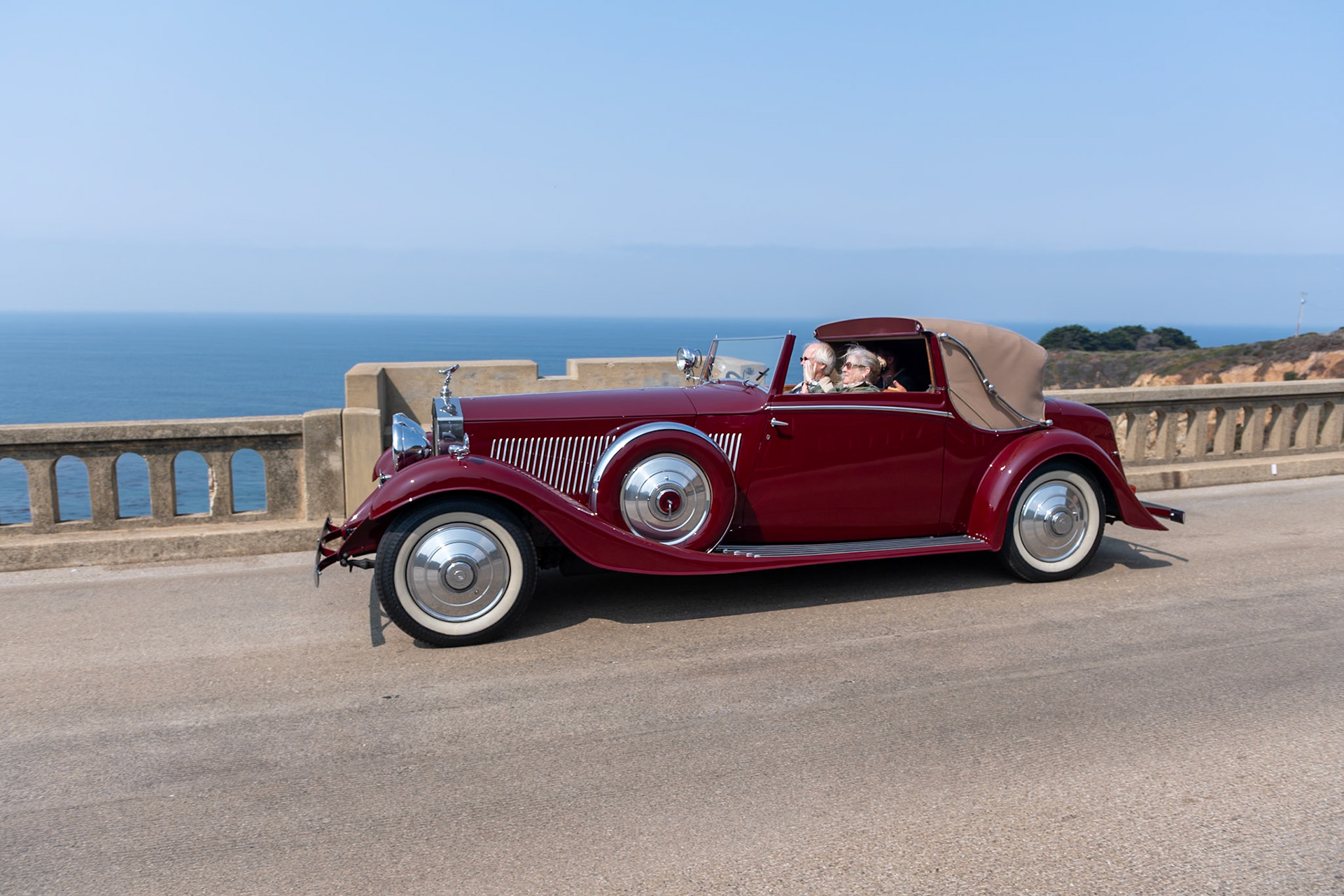 The much-improved Rolls-Royce Phantom II was introduced in September 1929, replacing the outdated New Phantom. Between 1929 and 1935, 1,672 Phantom IIs were built, including 280 on the stronger and shorter 144-inch Continental chassis, built to carry four people in comfort at high speeds. To balance the heavy chassis, lightweight coachwork was often fitted on it; the majority of Phantom IIs had 4-door closed coachwork, but a small number were fitted with more stylish designs, such as this Drophead Sedanca Coupé built by H. J. Mulliner in London. Described by Mulliner as a sportsman’s coupé, this is one of five similar PII Continentals built to be as lightweight as possible; they even included a special Exonite cellulose–covered aluminum steering wheel designed for aircraft. This Phantom II (chassis 55RY) was originally purchased by John “Jack” Upson, the owner of the famous Monseigneur Restaurant in Piccadilly and the chairman of the Dolcis shoe empire. It was acquired by its current owner in 1987.