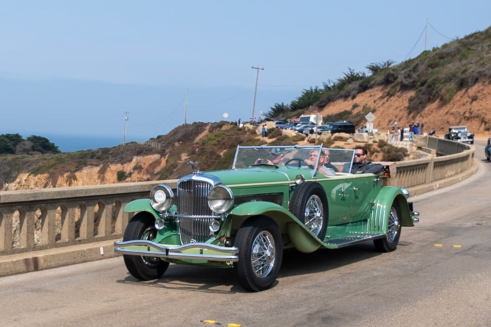 The Duesenberg Model J was available on either a long wheelbase of 153.5 inches for 7-passenger coachwork or a standard chassis of 142.5 inches. This Duesenberg J with Tourster coachwork by Derham is built on the longer chassis. The Tourster style was designed by Gordon Buehrig and, unlike other Dual Cowl Phaetons, it features a second windshield that slides up and down behind the front seat by means of a crank handle. The Tourster was Buehrig’s favorite design and he chose the Derham Body Company of Rosemont, Pennsylvania, to be the exclusive builder of this coachwork. This Duesenberg (J451) is one of eight original Tourster models. It was sold new to David G. Joyce of Chicago. Today it is one of very few remaining original examples of what many consider to be Derham’s most beautiful coachwork.