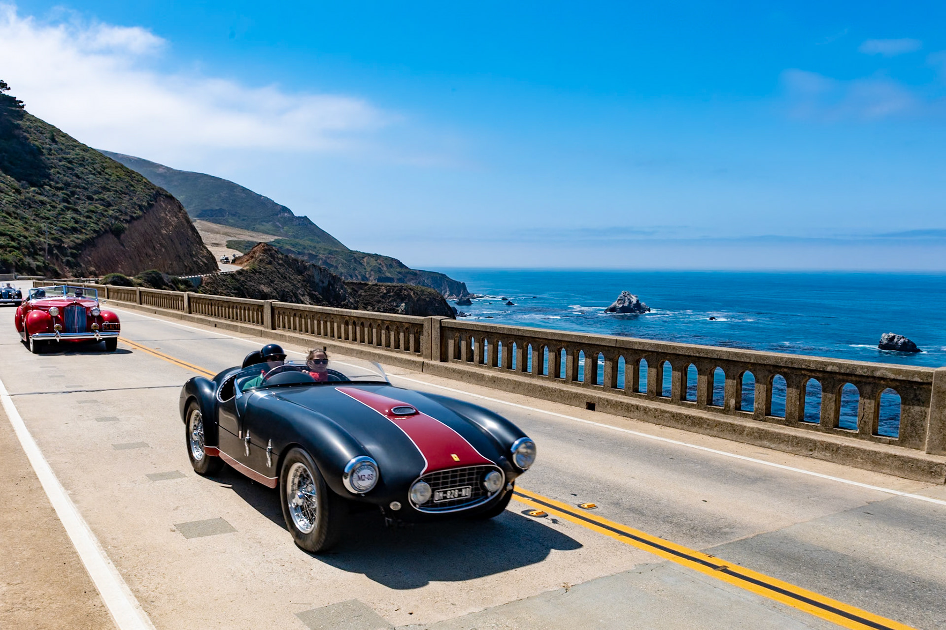 This 1953 Ferrari 166 MM first carried a Vignale coupe body when delivered to its first owner, Jaques Herzet. After racing in the Coupe de Spa-Francorchamps, the Rallye des Alpes, the Liege-Rome-Liege, and the Tour de France, the car placed second in the 1953 European Championship. Herzet then took the car to South America for another series of races. After returning to Europe, the car was sent to Carrozzeria Oblin in Brussels to be re-bodied as the spyder it is today. With its new look, this 166 MM (chassis 0300M) soon raced again; at the 1954 Twelve Hours of Reims, Herzet shared the drive with Johnny Claes. The car’s racing days continued until 1957 when Herzet hung up his goggles for the last time. The car has recently changed hands and has been restored to the condition it was in at the end of the 1954 season, with matte-black paintwork and a glossy red racing stripe.
