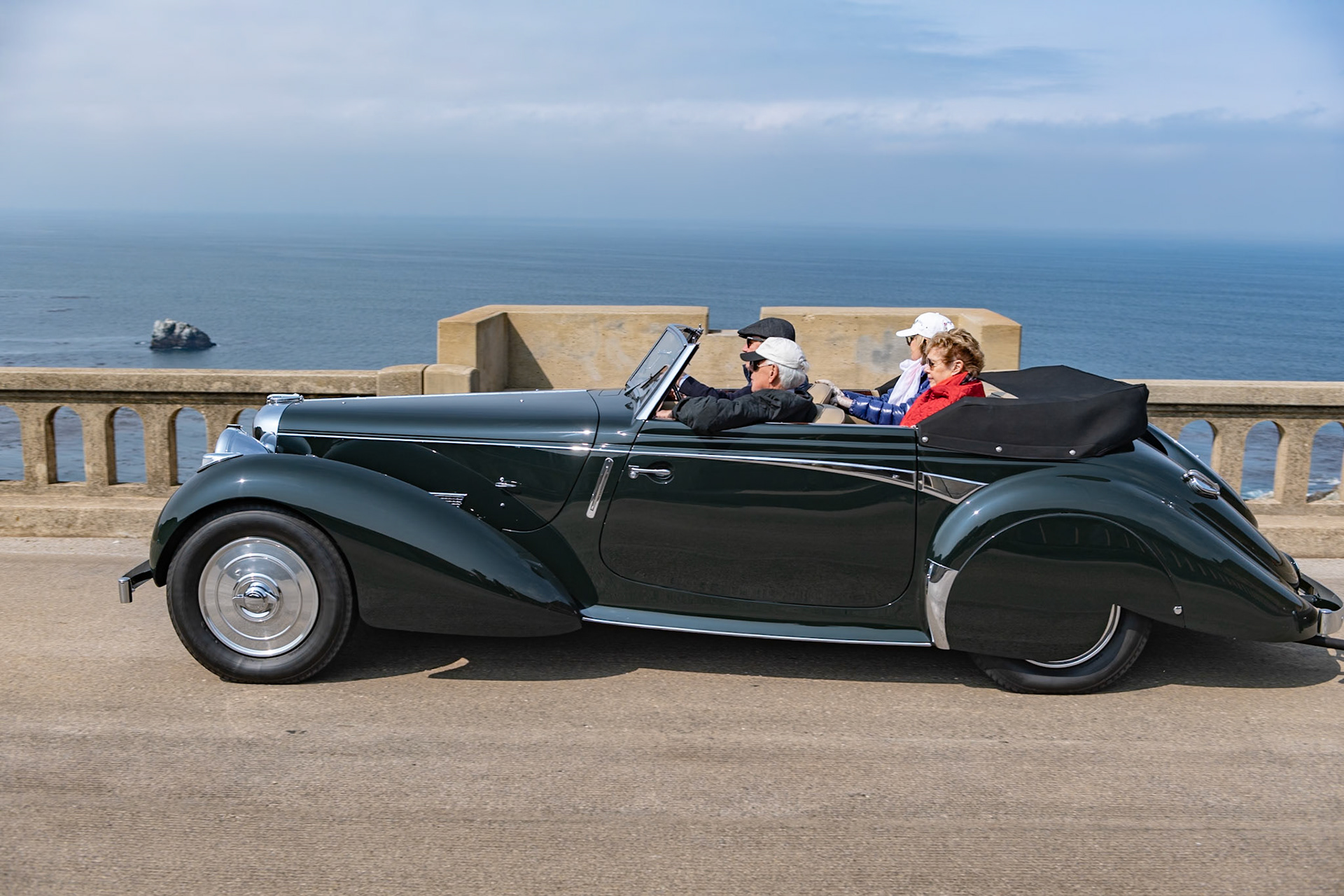 This Lagonda V12 Rapide was delivered to James Young in South London to have a special drophead coupé body fitted in October 1939. This chassis is one of just two Lagonda Rapides that does not carry the standard Frank Feeley–designed drophead coachwork, and it has a rear-mounted spare wheel instead of the side-mounted spares seen on factory-bodied cars. It was ordered for Anthony Gillson and his wife, American heiress Priscilla of Gloucestershire, England. Toward the end of the war, the car was purchased by Davies Motors, which had taken over servicing Lagondas following the closure of the factory in 1939. This car remained in England until 1957 when, with just 10,000 miles on the clock, it was exported to Australia and its new owner, a resident of New South Wales. In 2015 it was purchased by its current owner and sympathetically refurbished in New Zealand, still with less than 32,000 miles under its wheels.