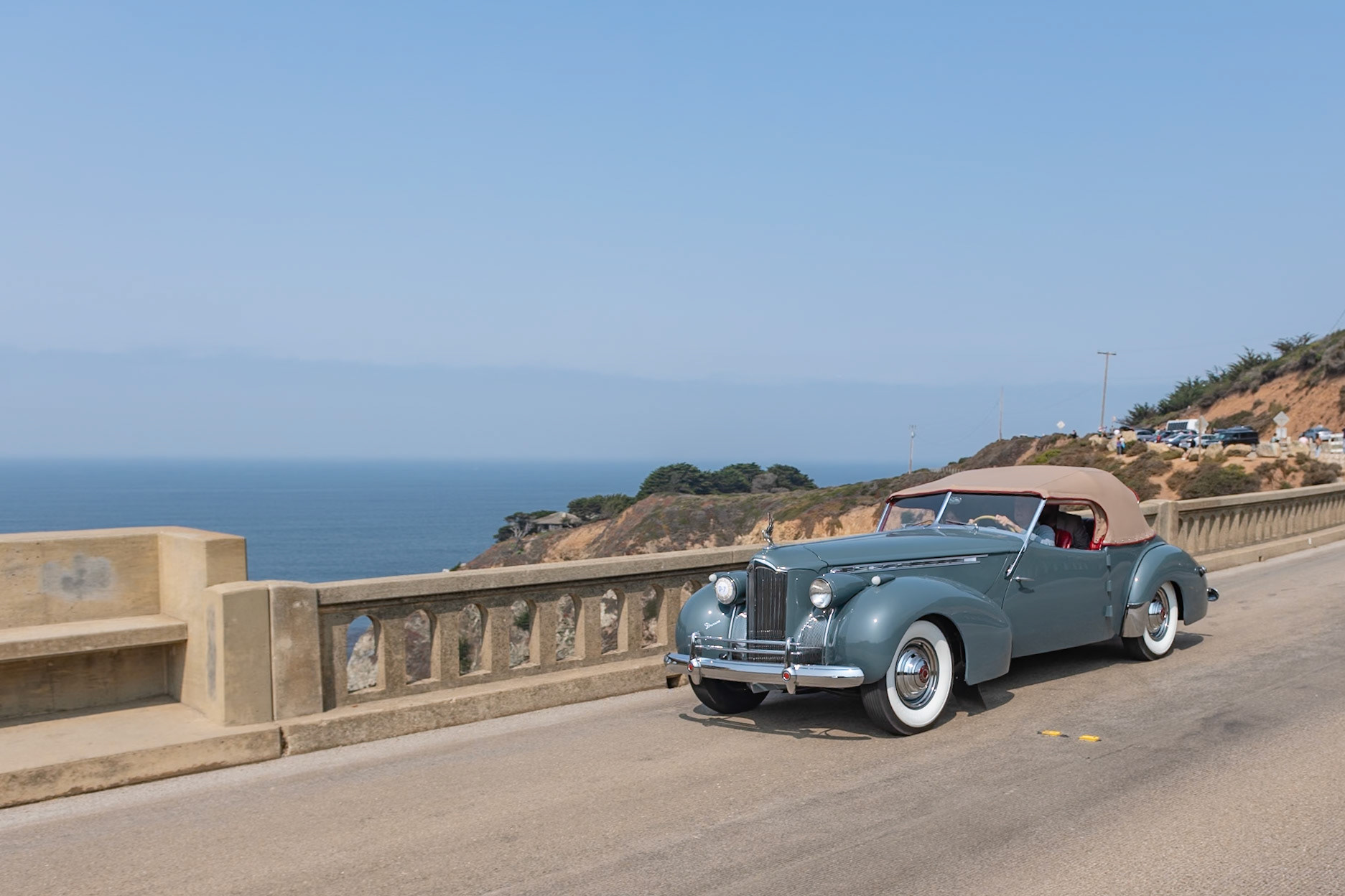 The Packard Super Eight was the larger of the two 8-cylinder models produced in 1940, and its 356-cubic-inch, straight-8 engine benefitted from an overdrive gearbox that made the cars perfect for high speed touring. The Custom Super Eight 180 can be identified by its distinctive hubcaps and hood louvers along the sides. The custom body era was drawing to a close by 1940, but Packard catalogs continued to offer several body styles, including a Club Sedan as well as this Darrin-bodied Convertible Victoria that, as with many of Howard “Dutch” Darrin’s designs, were often created for Hollywood celebrities. The first owner of this Convertible Victoria kept it in very original condition for nearly fifty years. The current owners bought it in 2014 and restored it, and this is the restored car’s first public appearance.