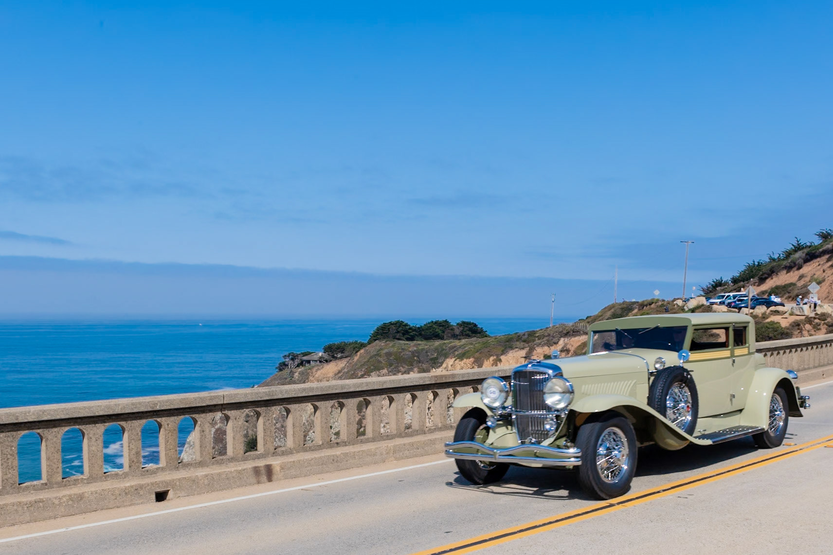 This Duesenberg (J354) is one of just two short wheelbase Model Js to be fitted with Victoria Coupe coachwork, which was designed by Gordon Buehrig and built by the Judkins Company of Merrimac, Massachusetts. The left armrest of the passenger compartment features a wood veneer box originally intended for hats but later fitted with a then-new-fangled Crosley automobile radio. This compartment very comfortably seats one passenger, but there is a collapsible jump seat alongside the driver for a footman or maid. This Duesenberg was originally delivered in September 1932 to New York financier Mortimer Warren Loewi, who owned it for five years. After passing through many other hands, owner Fred Kleptz restored the car to its original color scheme.