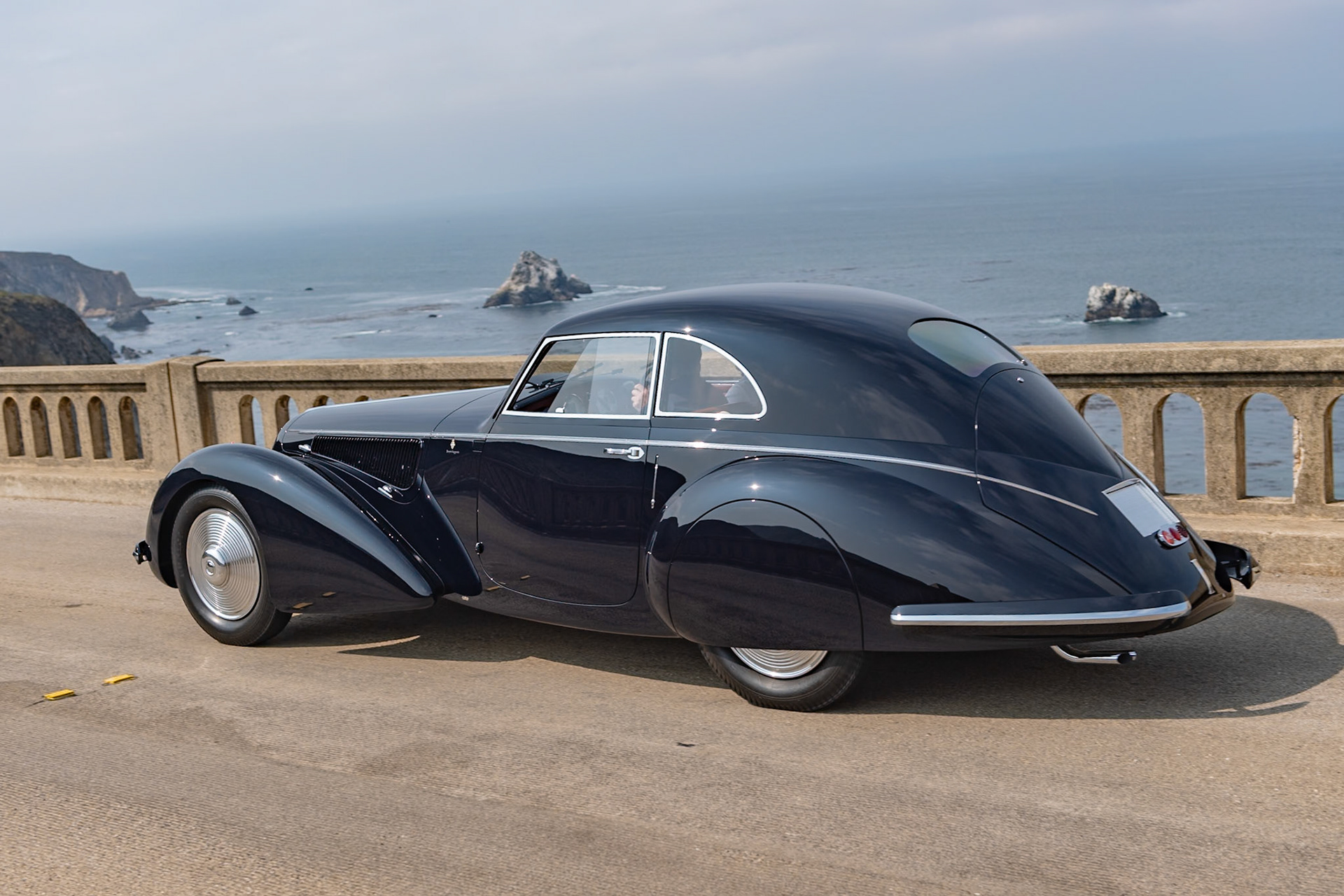 The Alfa Romeo 8C 2900 was probably the most technically advanced, modern, and compelling sports car that money could buy in the 1930s, and this particular 8C 2900B (chassis 412020) Lungo Berlinetta with Superleggera coachwork was a seminal work for both Alfa Romeo and Carrozzeria Touring. It was revealed to the world at the 1937 Paris Auto Salon, then appeared at the 1937 Milan Auto Show and at the 1938 Berlin Motor Show. It was also featured in many period magazines and in the Alfa Romeo sales brochure, where it was called the “Coupé Leggero.” It differs from the later 8C 2900 Berlinettas by having a more steeply raked aerodynamic front grille and no running boards. The car is believed to have remained in Germany through the 1950s. It was brought to the United States in 1956. This historic Alfa Romeo was first restored in the 1990s and was named Most Elegant Closed Car at the 2001 Pebble Beach Concours d’Elegance. The current owner has now restored the car to its 1938 Berlin Motor Show specification.