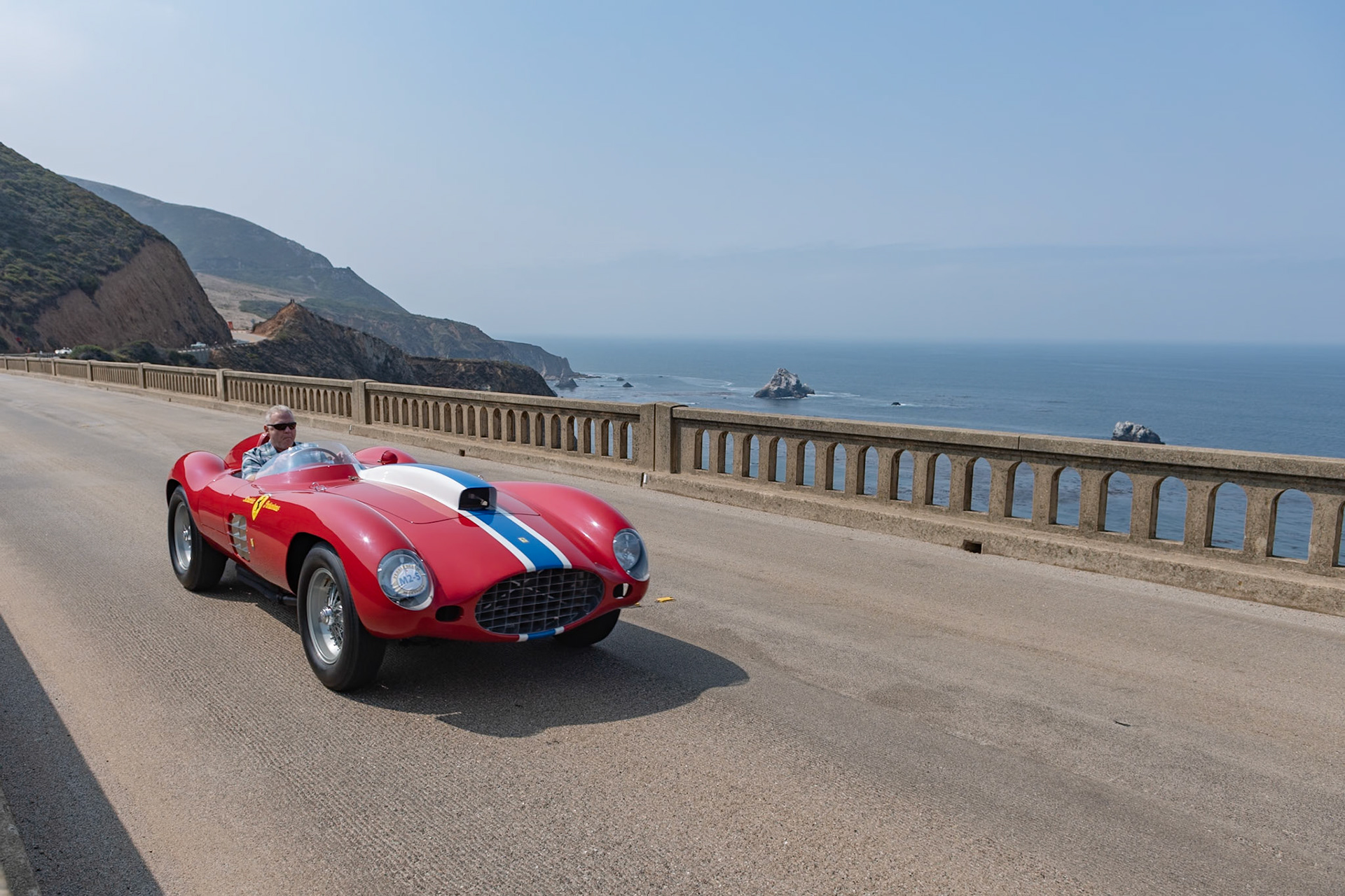 The Ferrari 410 Sport CM was developed from the Le Mans–winning Ferrari 375 Plus primarily for the Carrera Panamericana (the CM stands for Carrera Messicana), but also with an eye toward the growing importance of the North American racing scene. The new Aurelio Lampredi–designed, 5.0-liter V12 engine was the most powerful yet to leave the Ferrari factory. This 410 Sport CM (Chassis 0592 CM) is one of three 410 Spyders built by Scaglietti. It was sold initially to American team owner, Tony Parravano, and it first raced at Palm Springs where, driven by Carroll Shelby, it finished in first place. In 1957, Parravano headed to Mexico with a number of his race cars, not to compete in the Carrera Panamericana but because he was being chased by the IRS for tax “complications.” After crossing the border he was never seen again—although his cars turned up three years later! In 1970, this car was acquired by Robert Dusek, who restored it to the way it was when last raced by Scuderia Parravano.