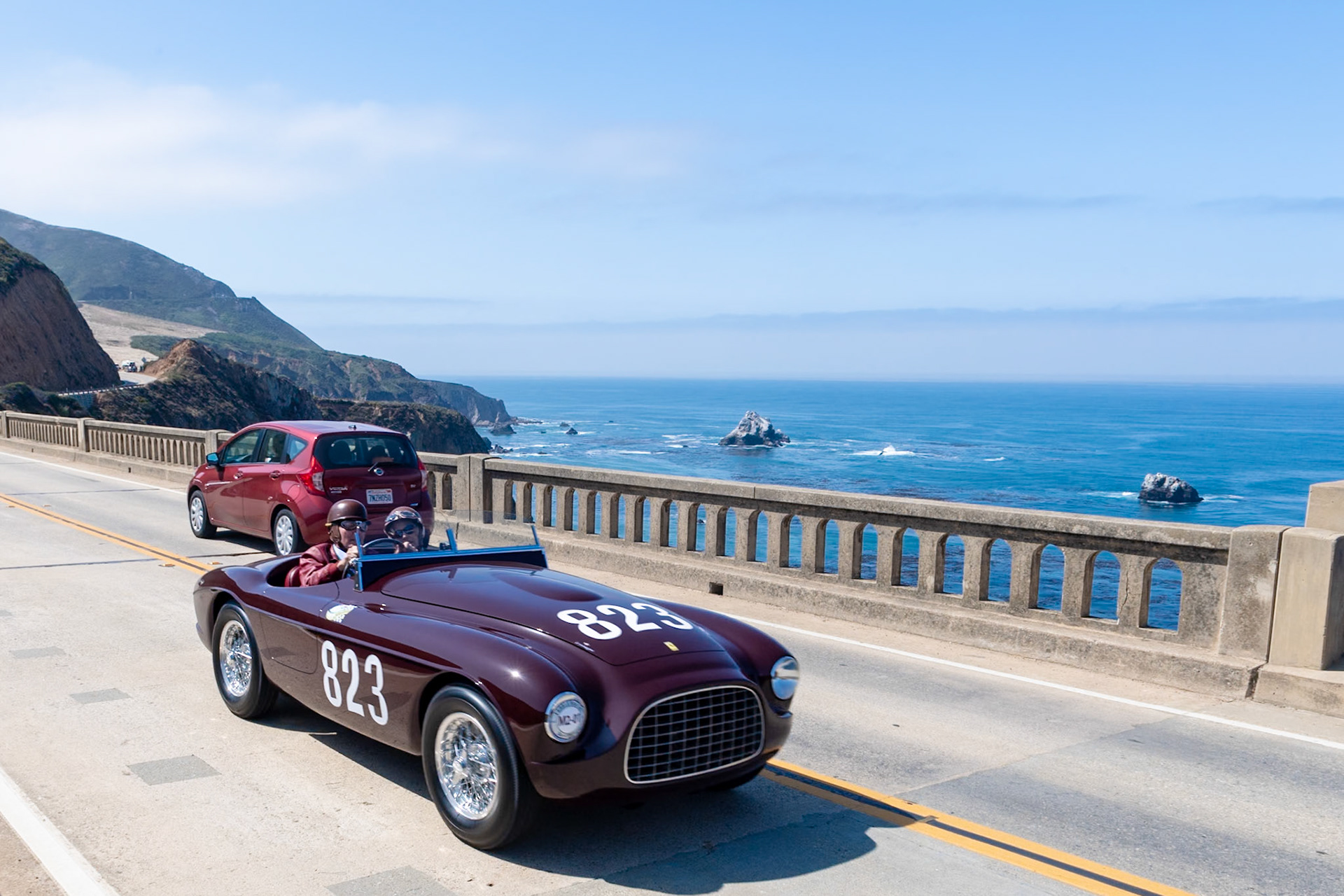 This car (chassis 0102E) is one of seven 2.3-liter Ferrari 212 Export Barchettas bodied by Touring. Its first owner, Pietro Palmieri, raced it in the Giro della Calabria and the Coppa Adriatica, finishing first in class and a second and fourth overall. It was later loaned to and raced to a class win by Bobby Baird in the 1951 RAC’s famed Tourist Trophy race at Dundrod, Ireland. In 1954 Phil Hill brokered the car’s sale to 20th Century Fox and it starred in the 1955 movie The Racers in heavily modified form. In order to gain some background footage, the car was first filmed being driven by John Fitch at the 1954 Mille Miglia and later at Monaco before being sent to California for its starring role. In 1955 the car was sold to Al Crundall of Carmel, who showed it at the 1966 Pebble Beach Concours d’Elegance. A modified body was later built for the car. In early 2015, the original body, chassis and engine were reunited and the car was restored to its original configuration.
