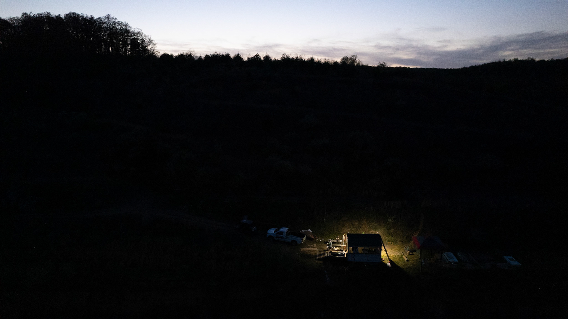 Sun setting behind cabin