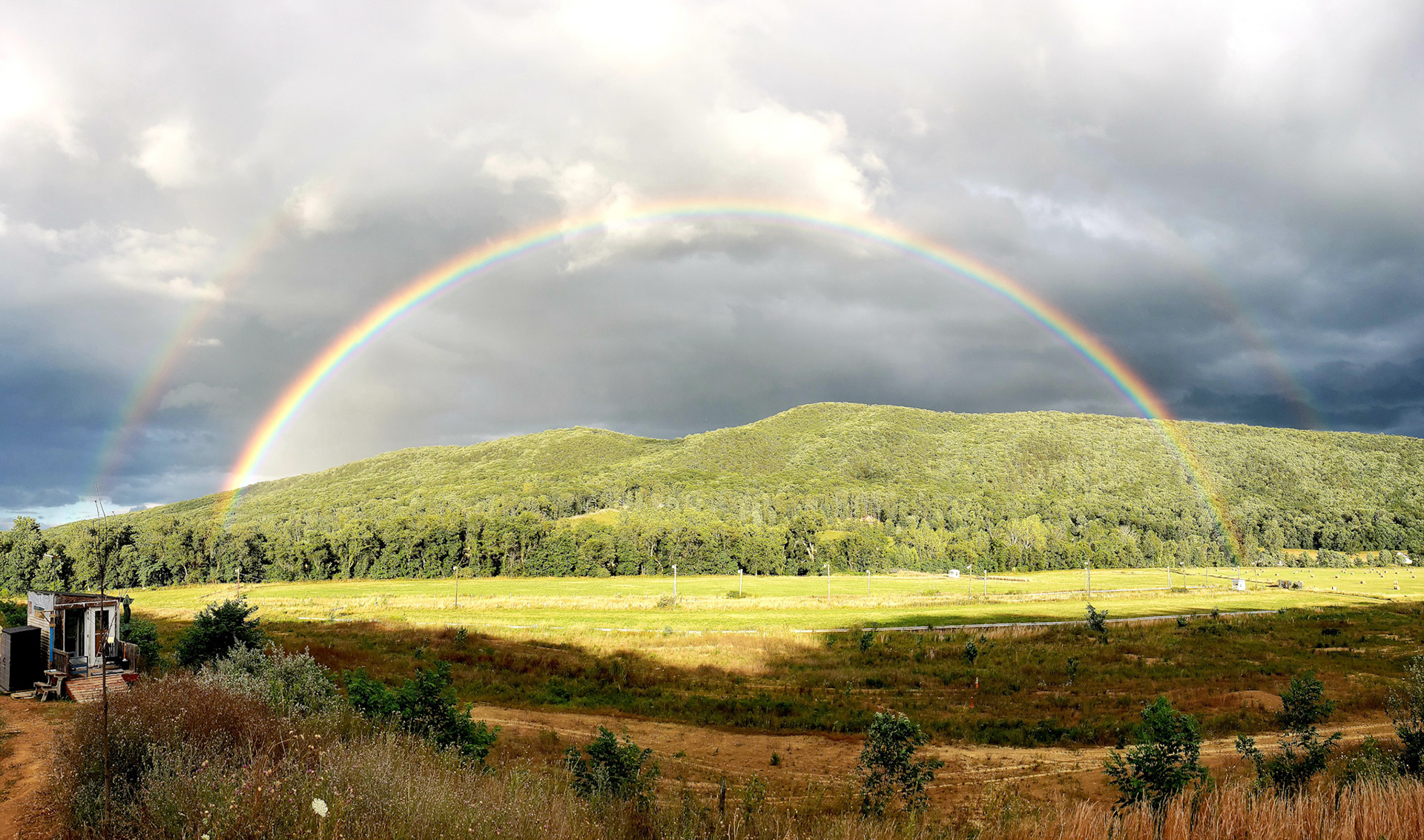 Double end-to-end rainbow.  Starts and stops on the property