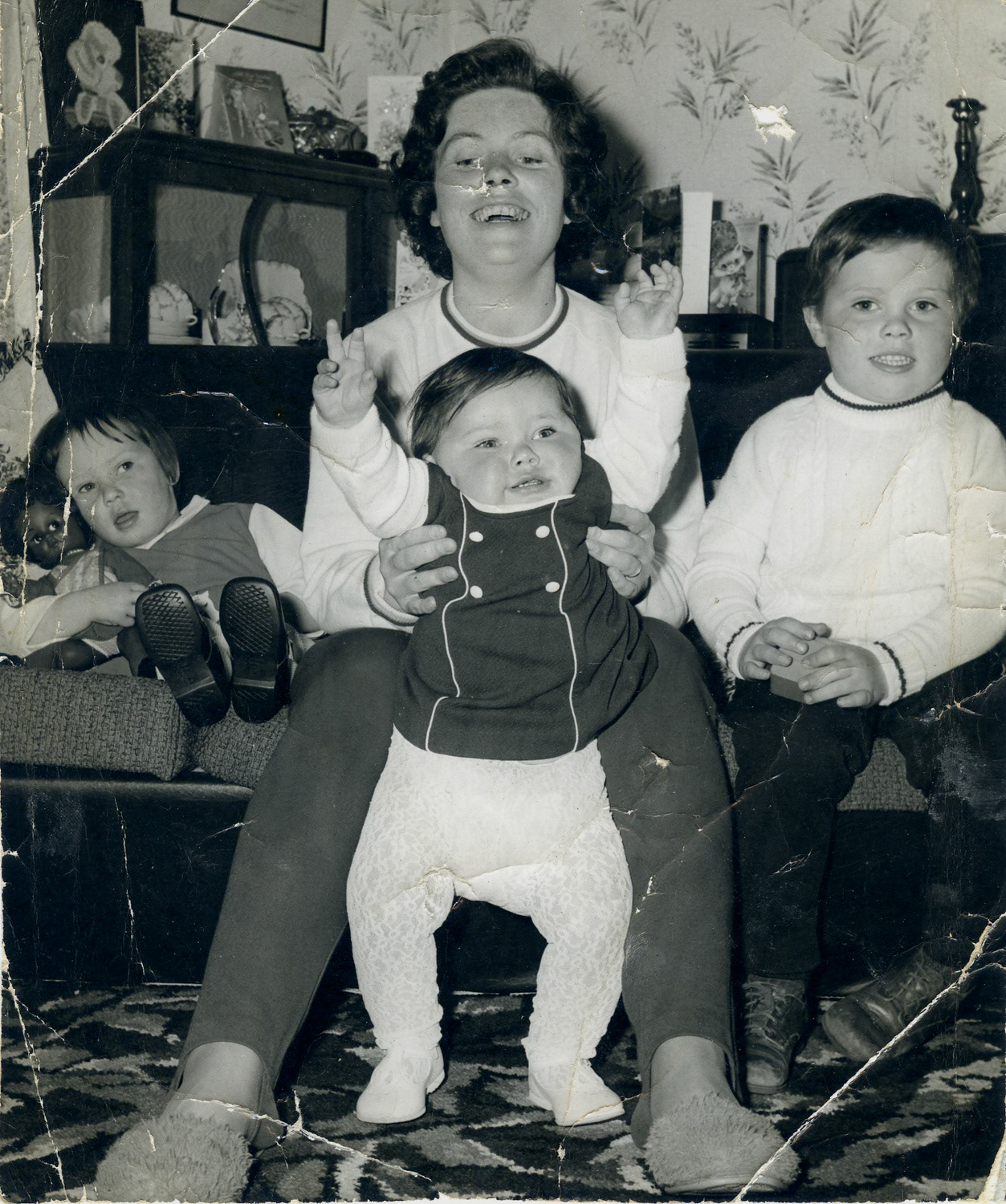 Lightly damaged image of family