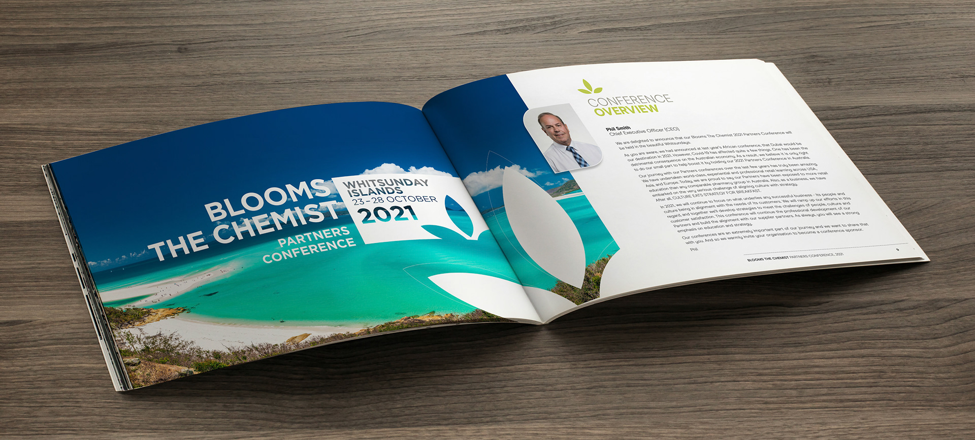 Photo blank. Open square format brochure on a wooden table