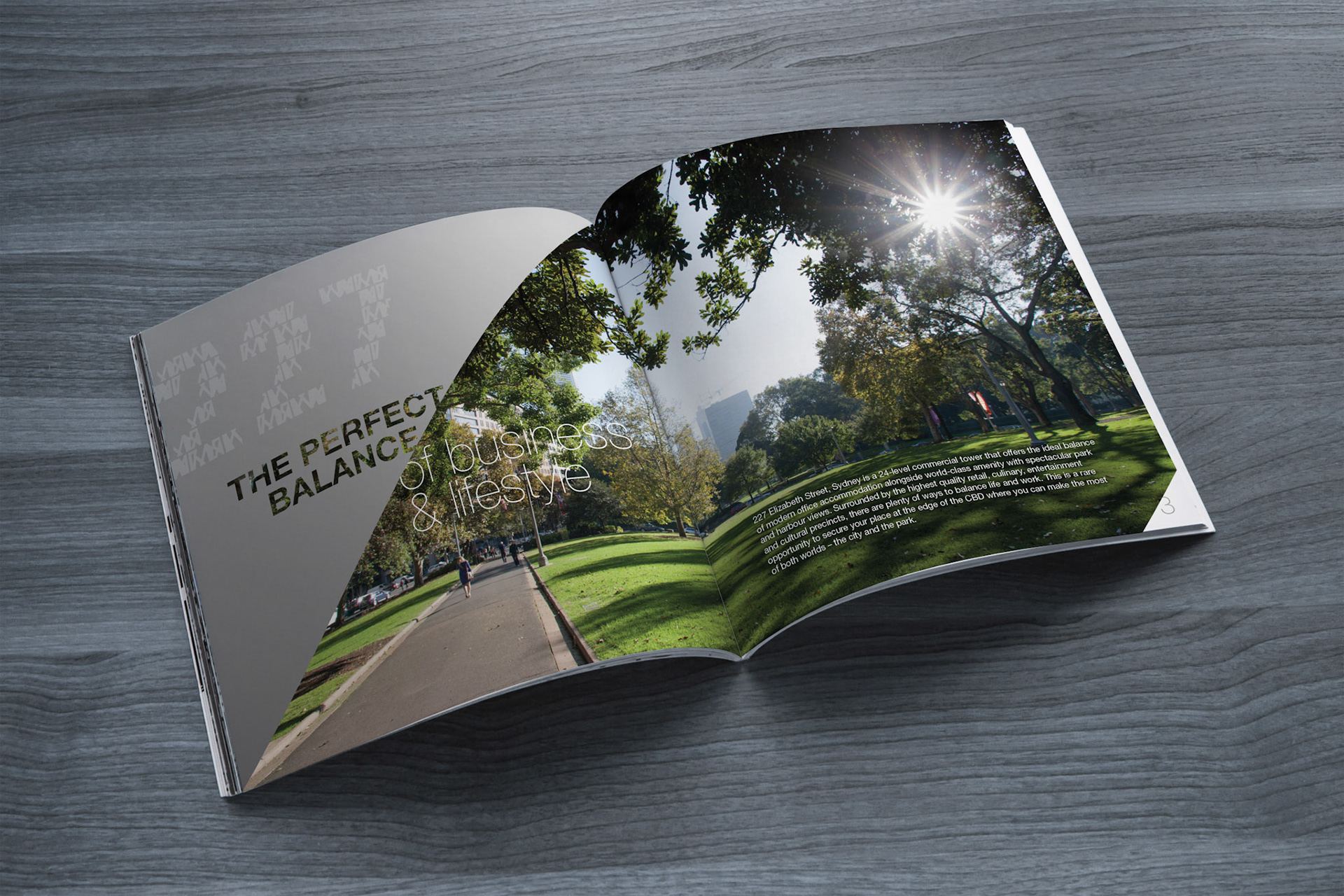Photo blank. Open square format brochure on a wooden table