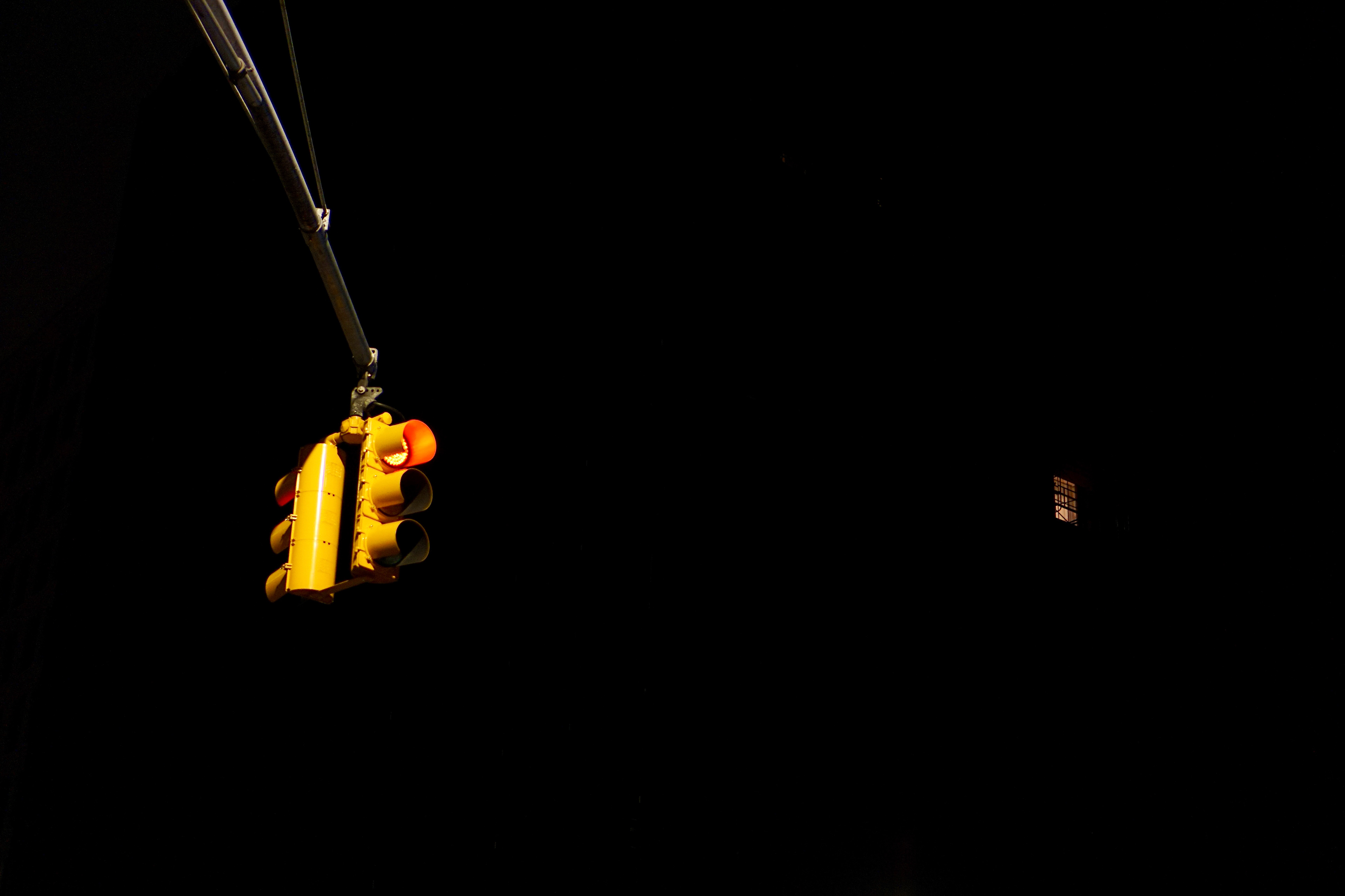 Single lit window in apartment building during NYC pandemic exodus, April 2020