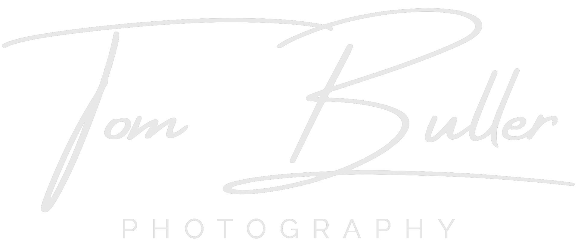 The Tom Buller Photography signature logo in warm grey.