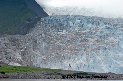 Mendenhall Glacier, Alaska with visitors and canoes parked at edge of water; UA-92916515-1