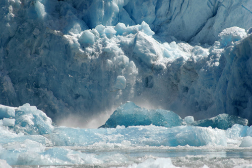 Tracy Arm Glacier calving, Alaska; birds flying away; ice splashing in the water; UA-92916515-1