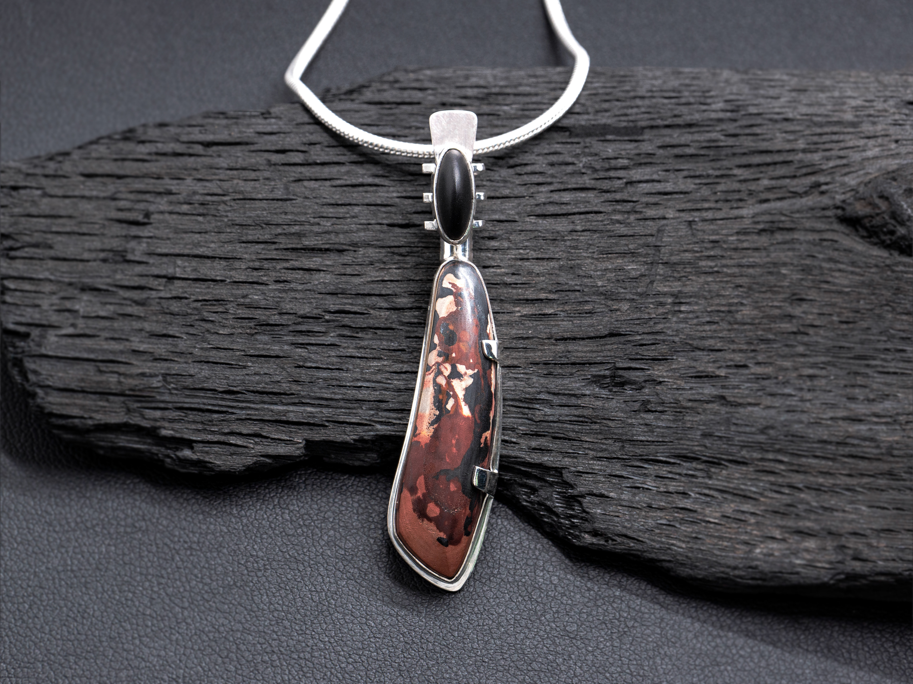 high dome matte black onyx and designer-cut indian paint stone set in sterling silver