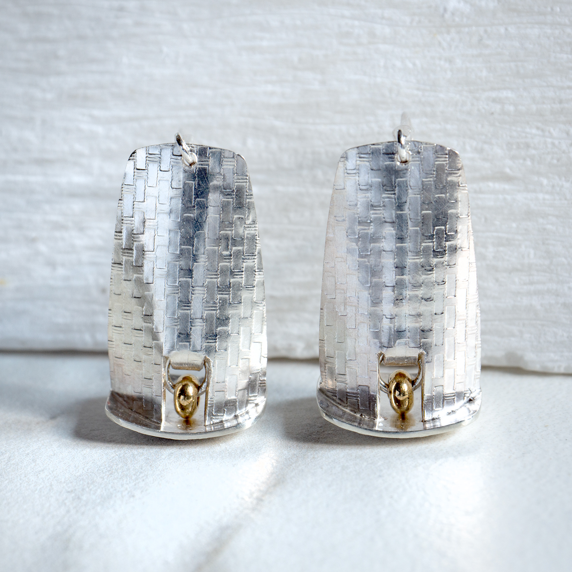 doorway drop earrings with brass accents