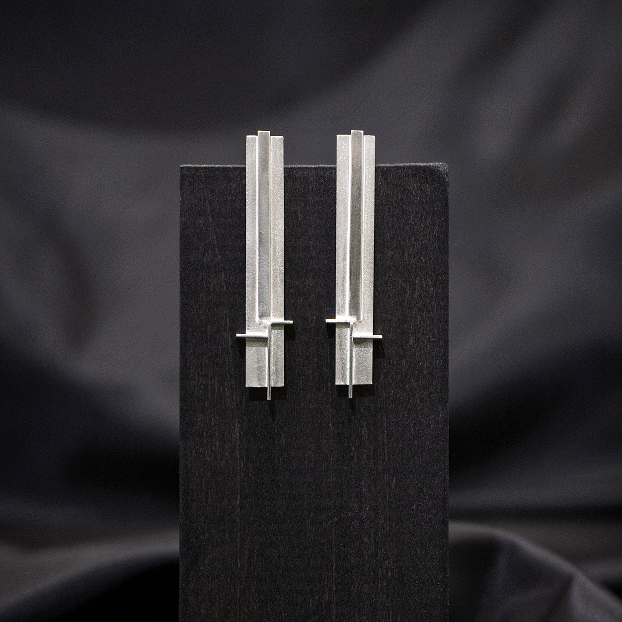 silver geometric planes studs