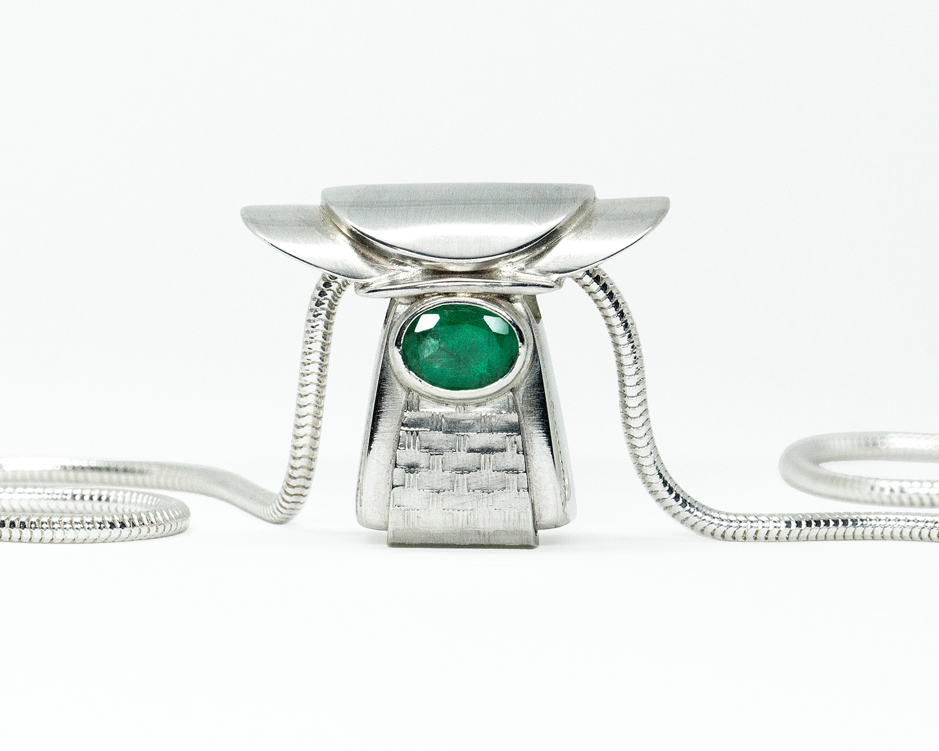 handmade sterling silver shrine pendant with bezel set emerald gemstone and silver snake chain