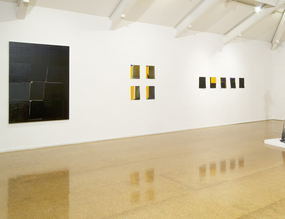 abstract paintings on a white wall