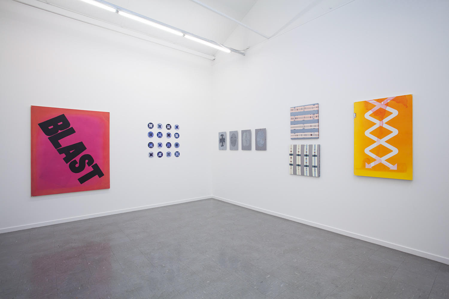 abstract paintings on a white wall