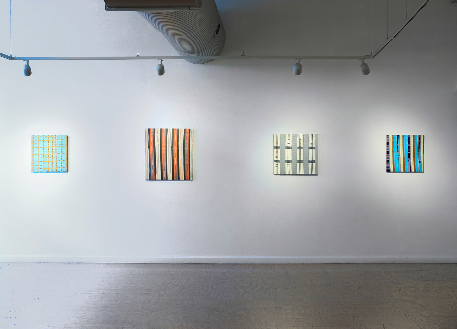 abstract paintings on a white wall